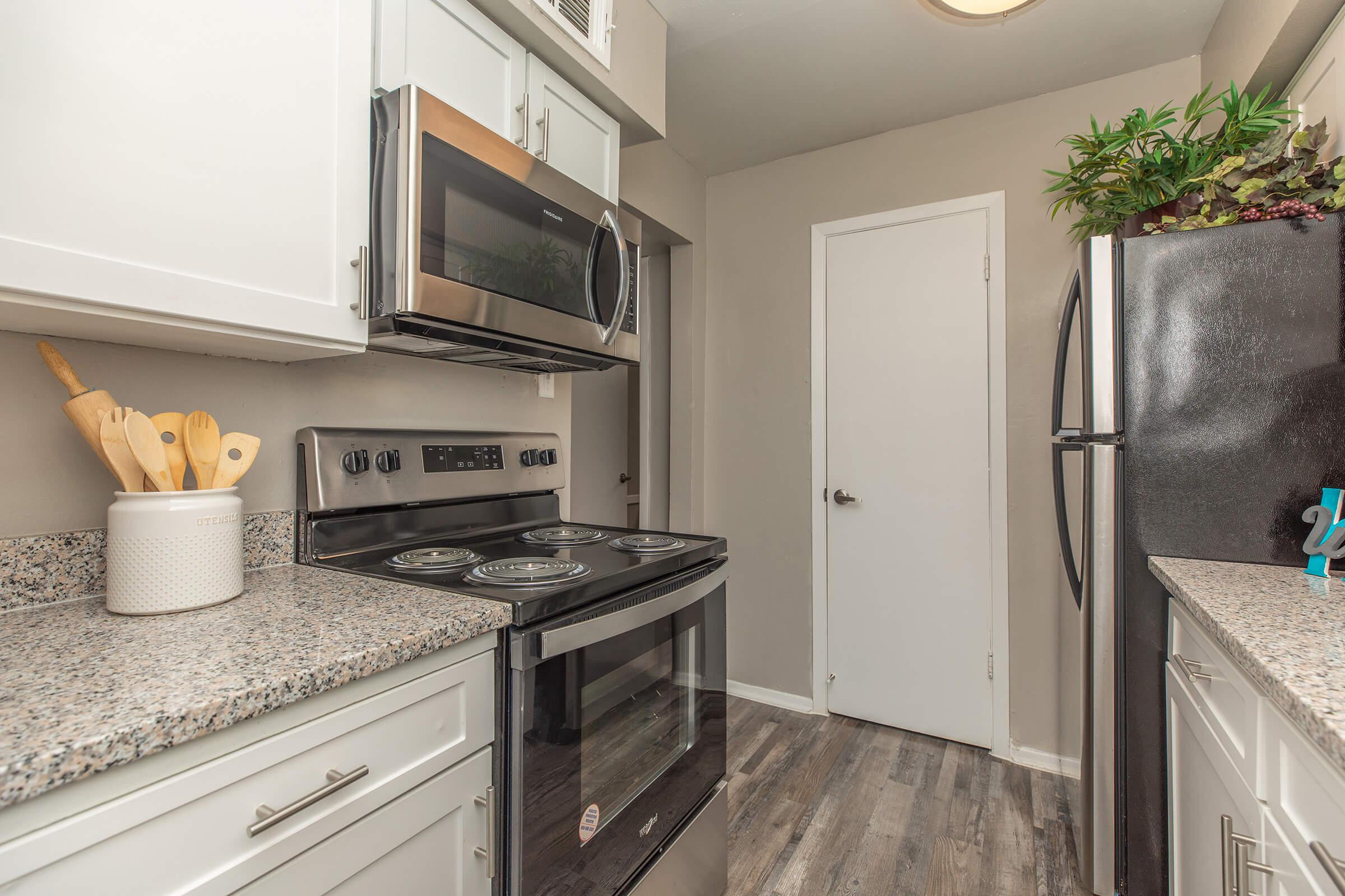 a kitchen with a sink and a refrigerator