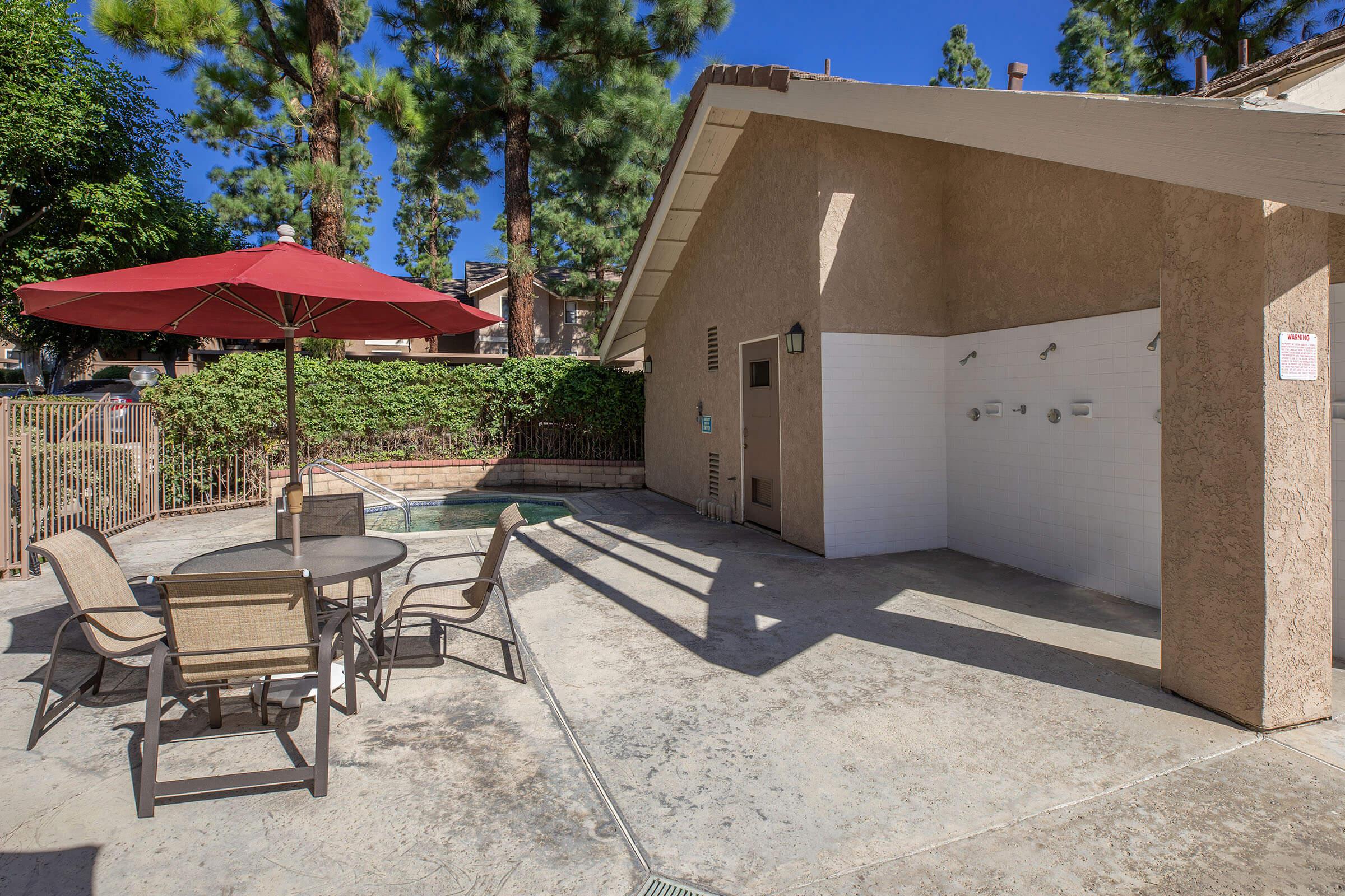 the community spa with a table and chairs