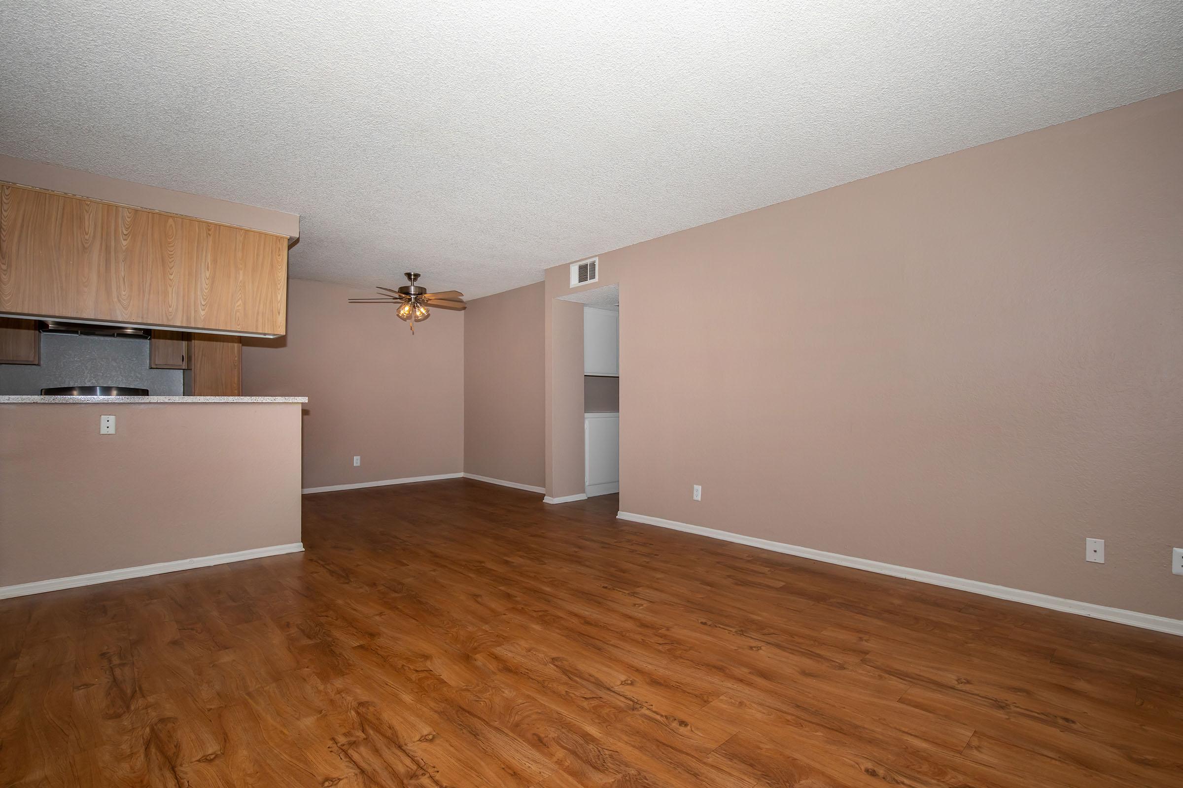 living room and dining room with wooden floors