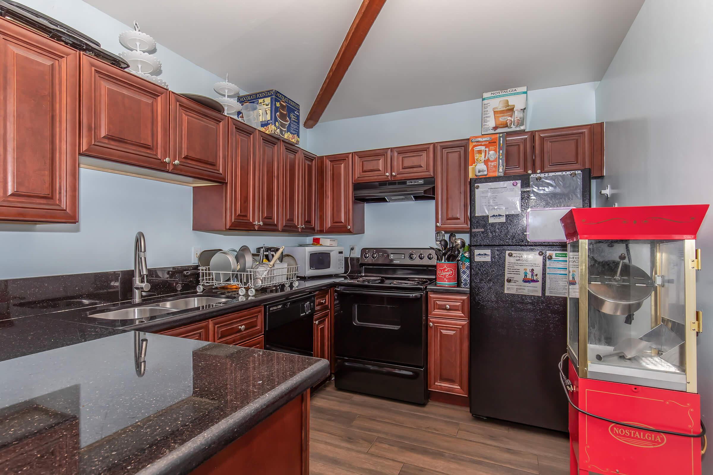 a large kitchen with stainless steel appliances