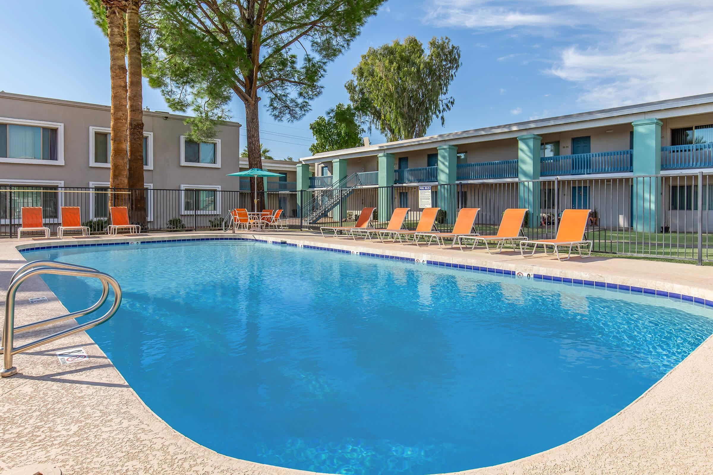 a large pool of water in front of a house