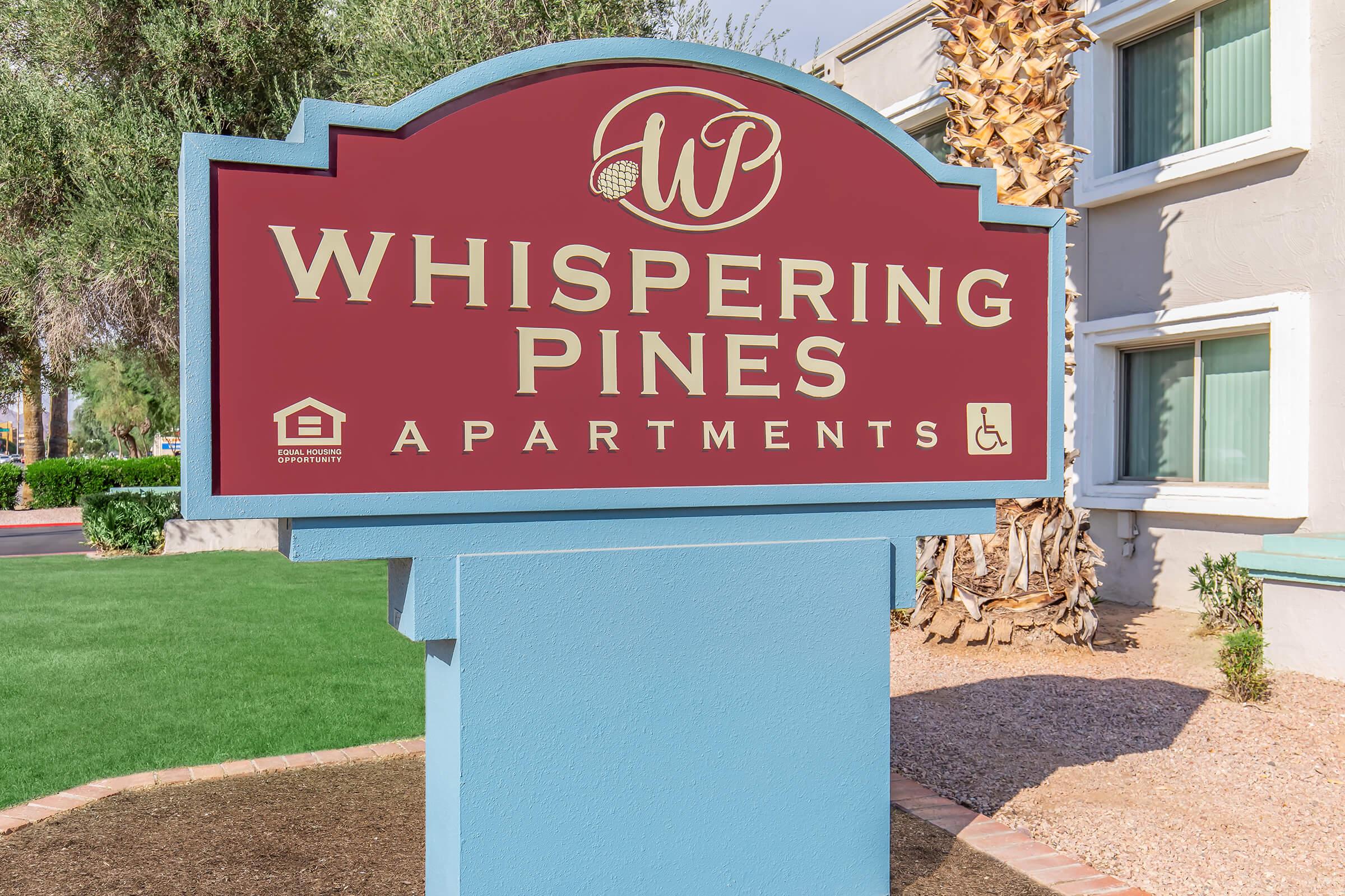 a sign in front of a brick building