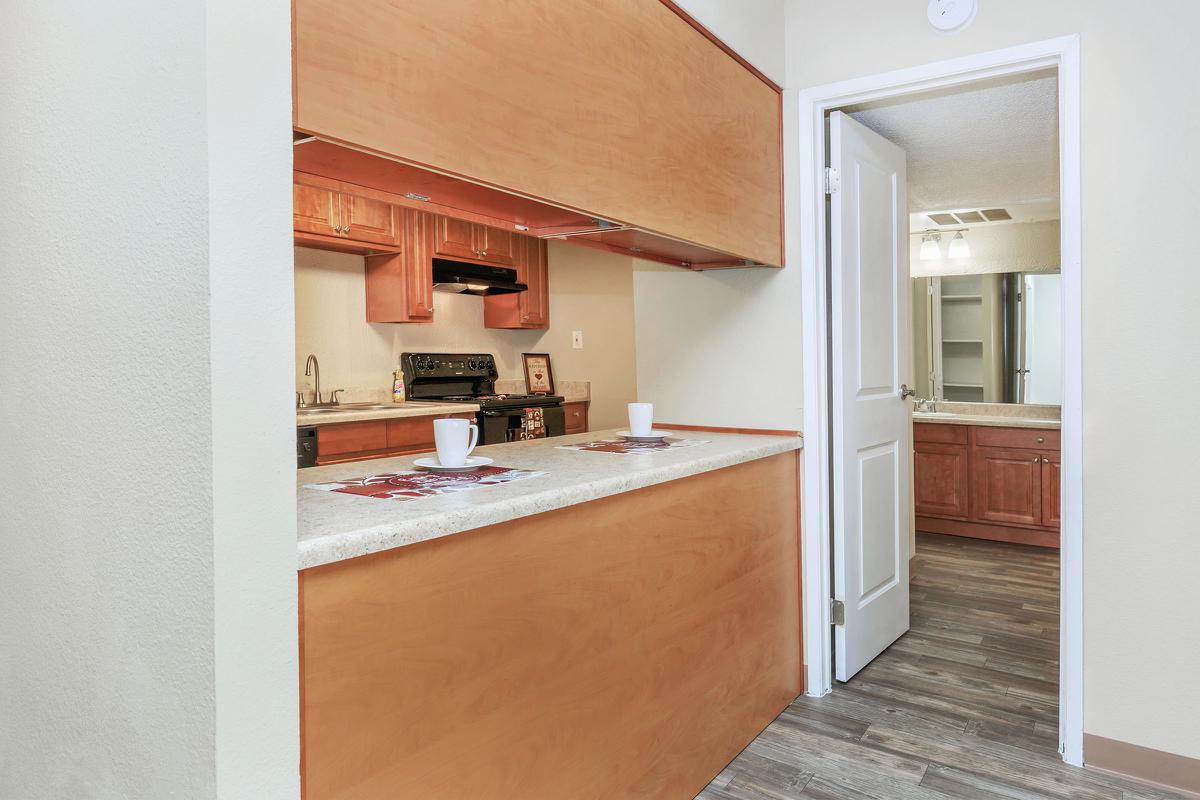 Hallway and bathroom with wooden floors