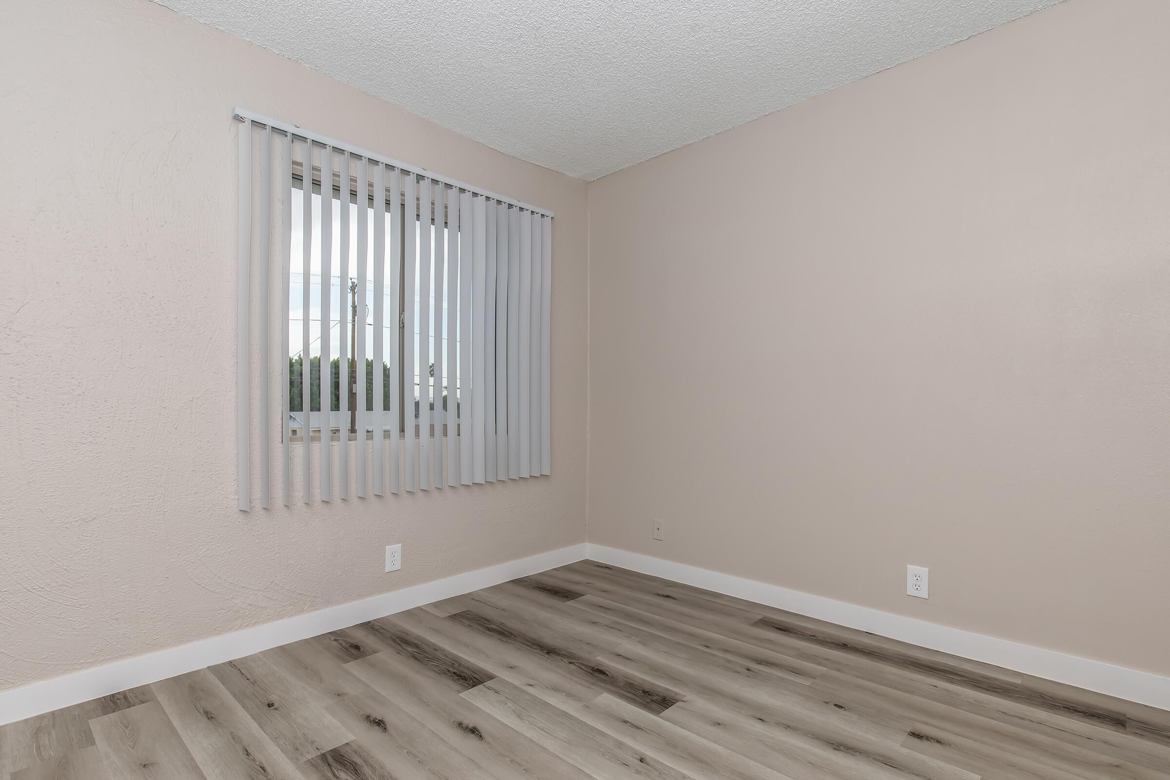 a bedroom with a large window