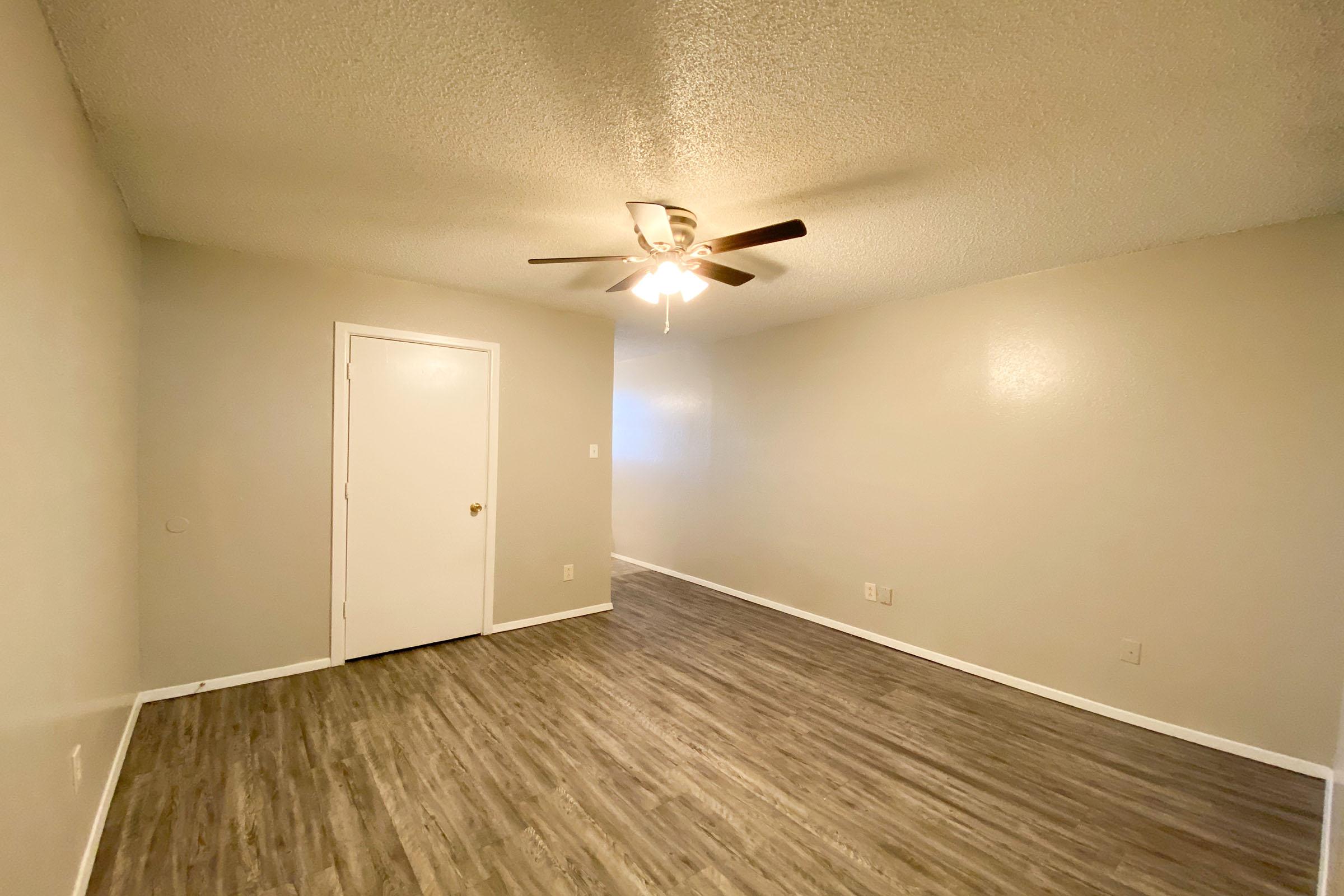 a kitchen with a wood floor