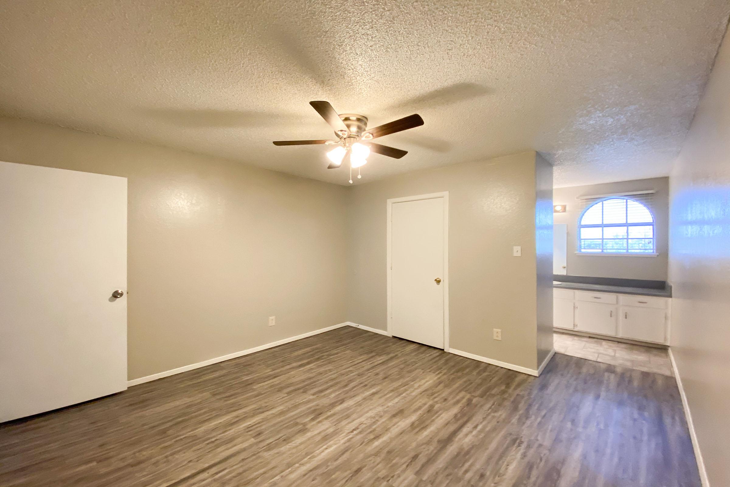 a kitchen with a wood floor