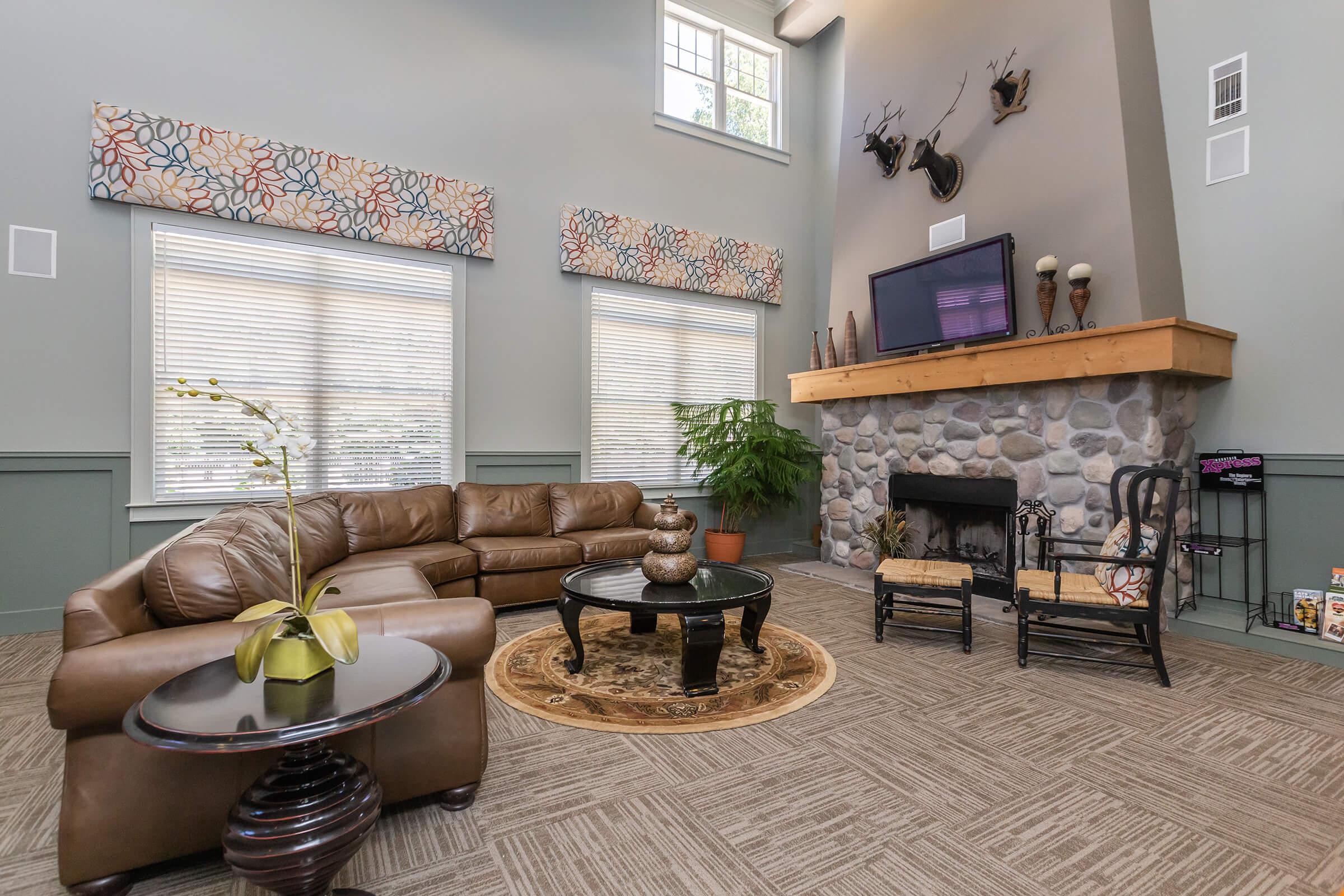 a living room filled with furniture and a fireplace