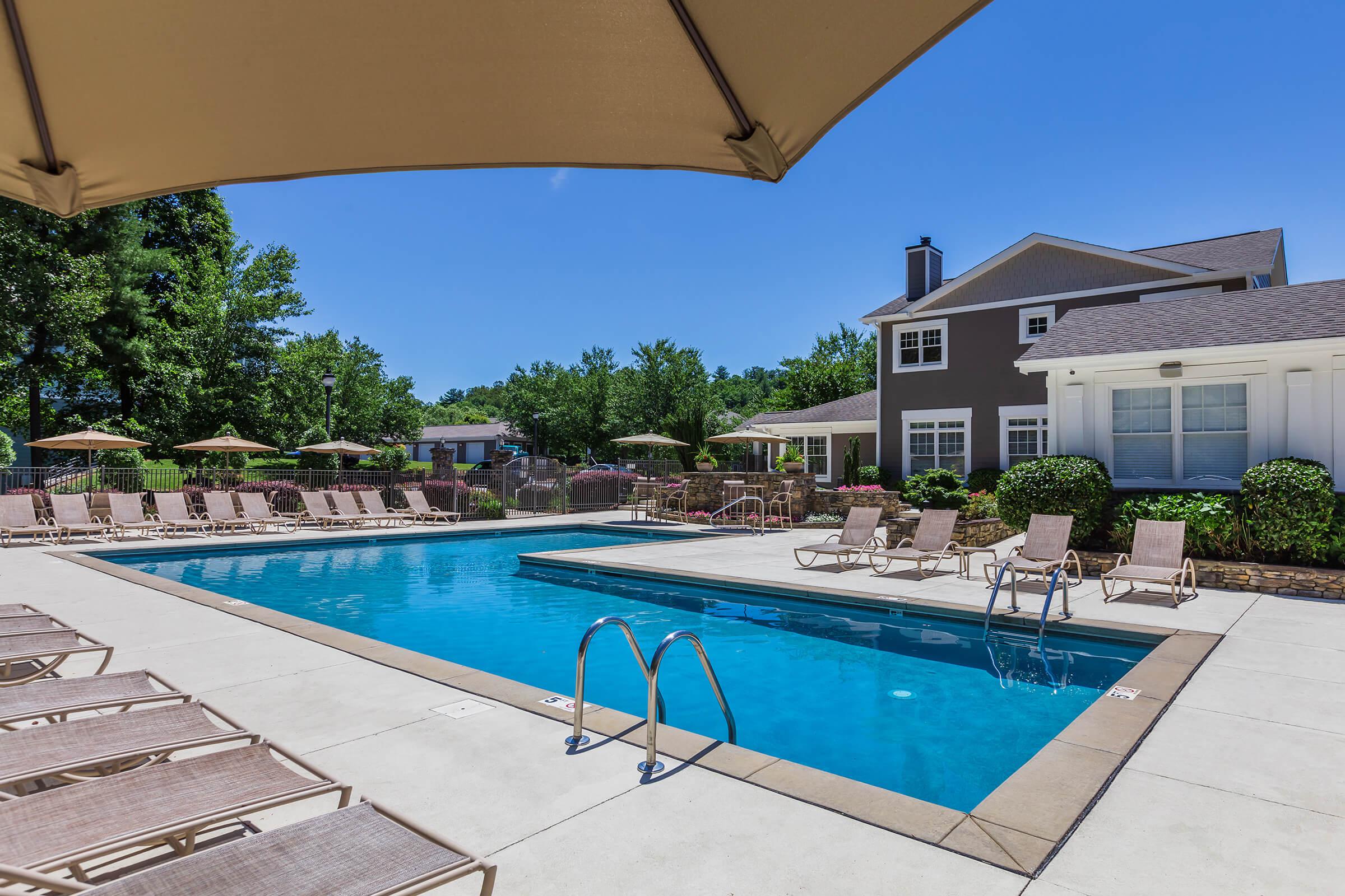 a pool next to an umbrella