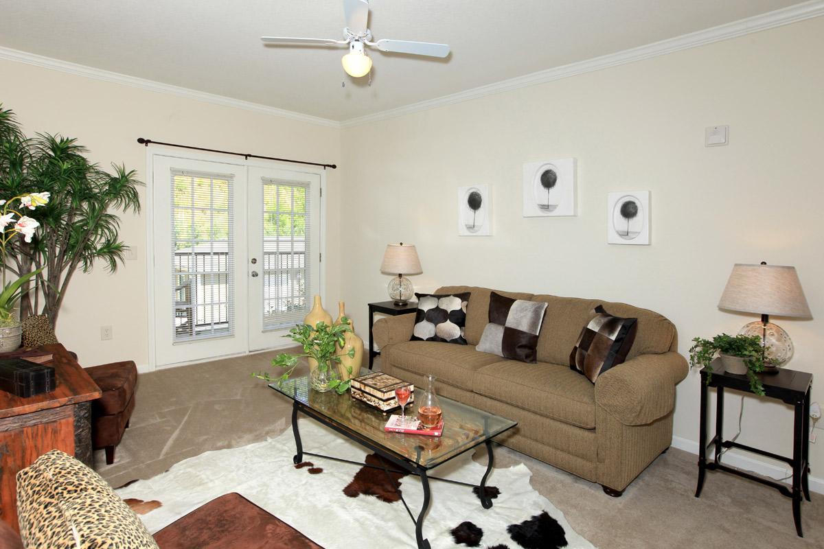 a living room filled with furniture and a fireplace