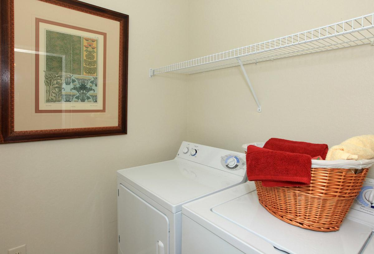 a bedroom with a bed and desk in a small room