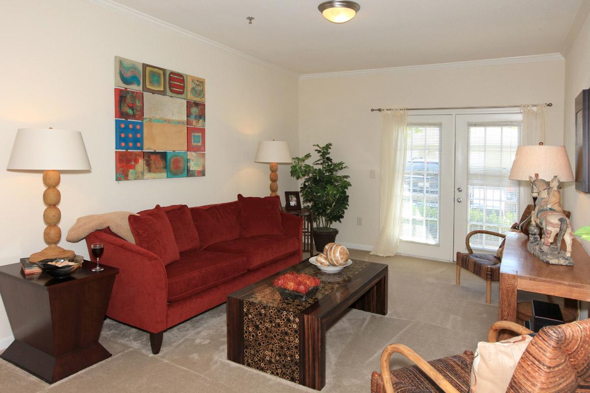 a living room filled with furniture and a fire place