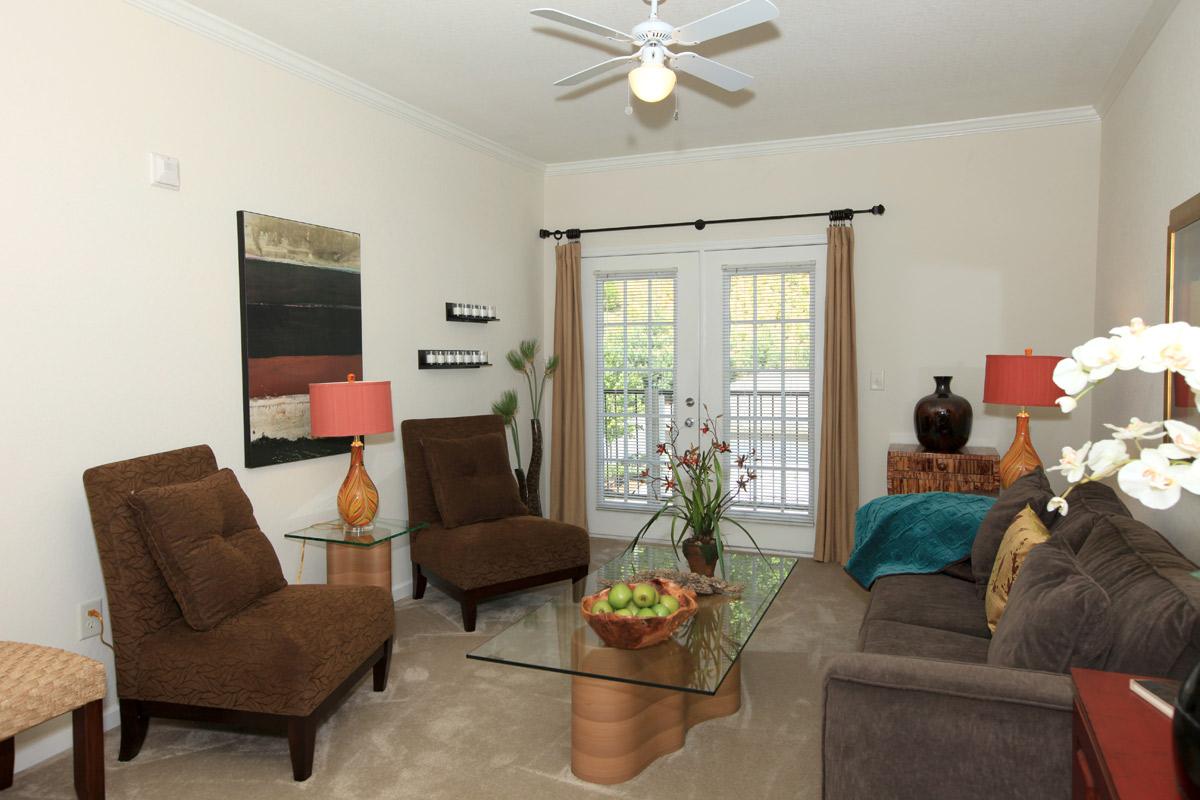 a living room filled with furniture and a fire place