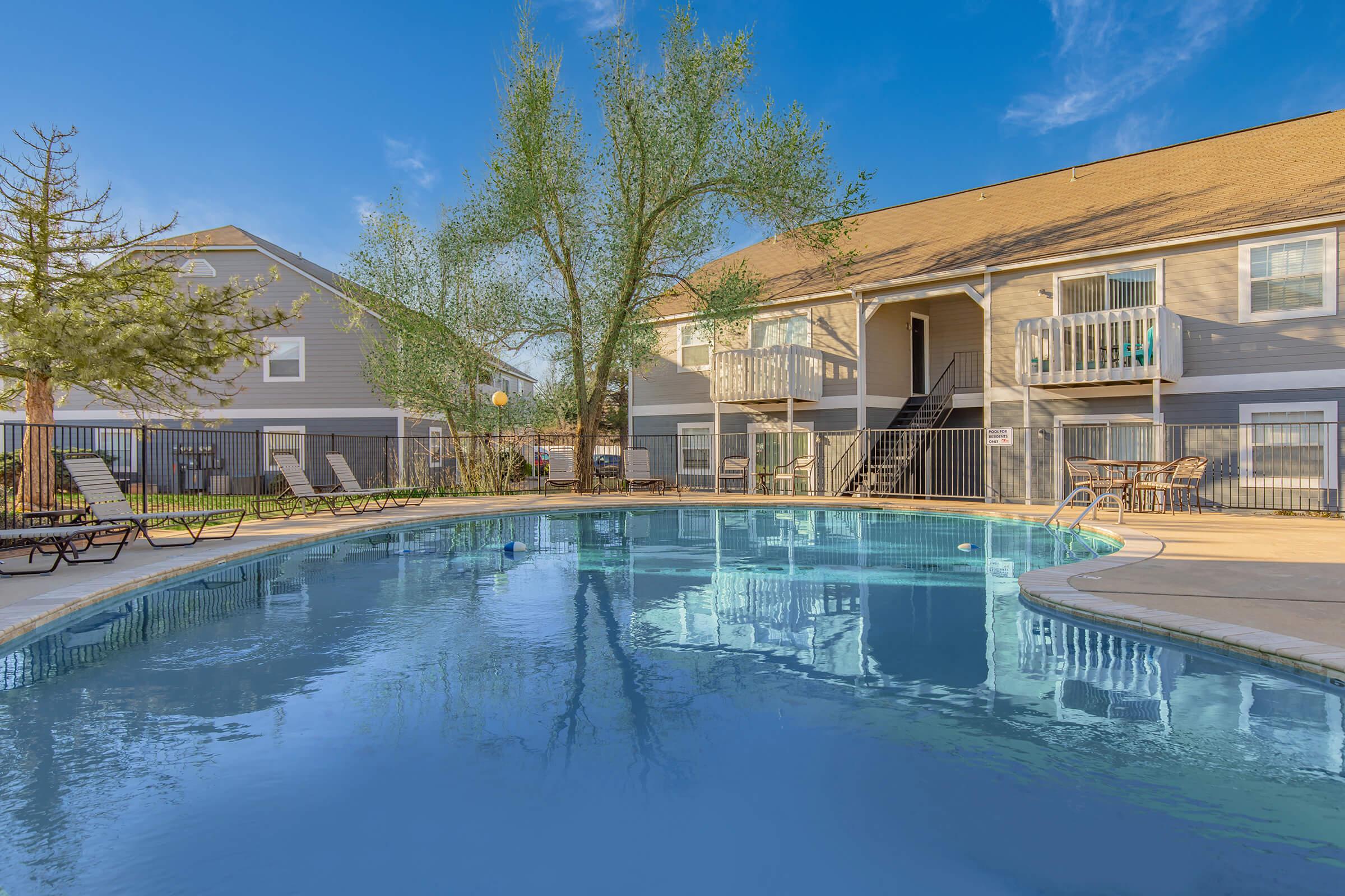 a large pool of water in front of a building