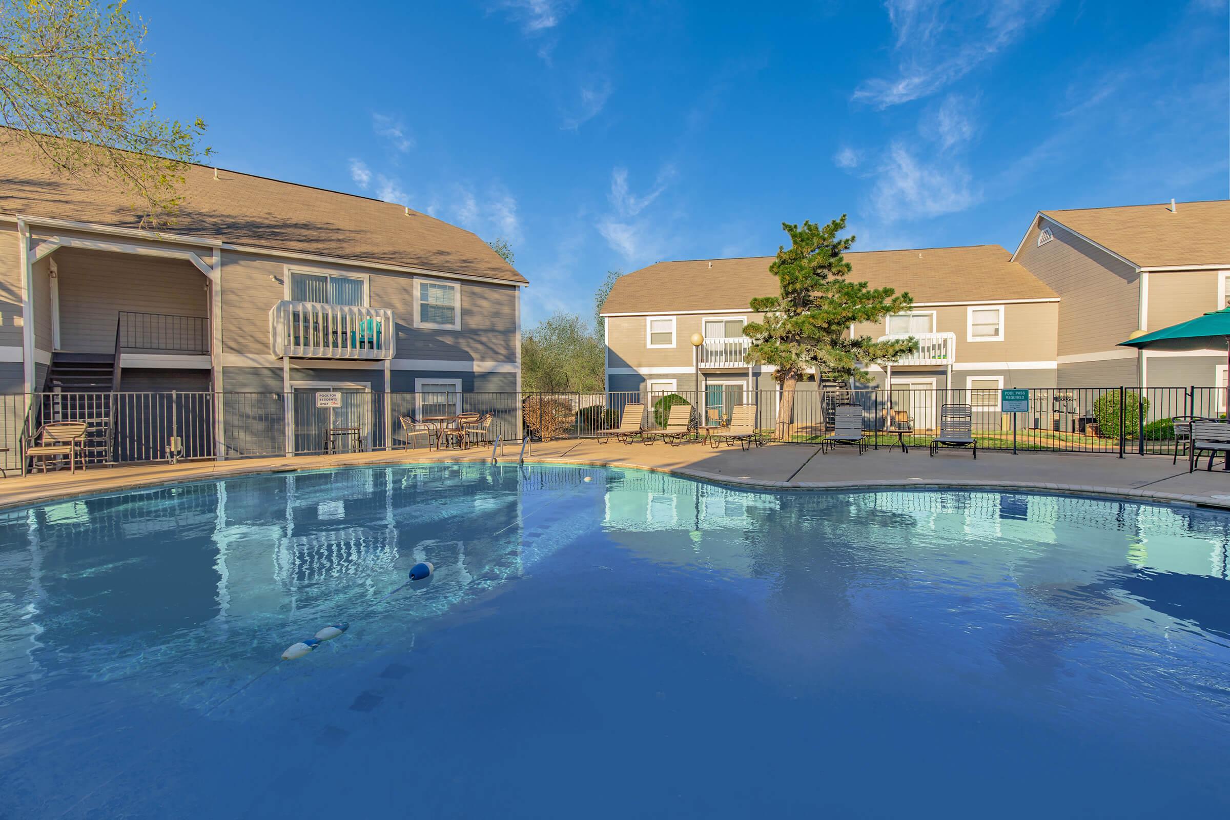 a large pool of water in front of a building