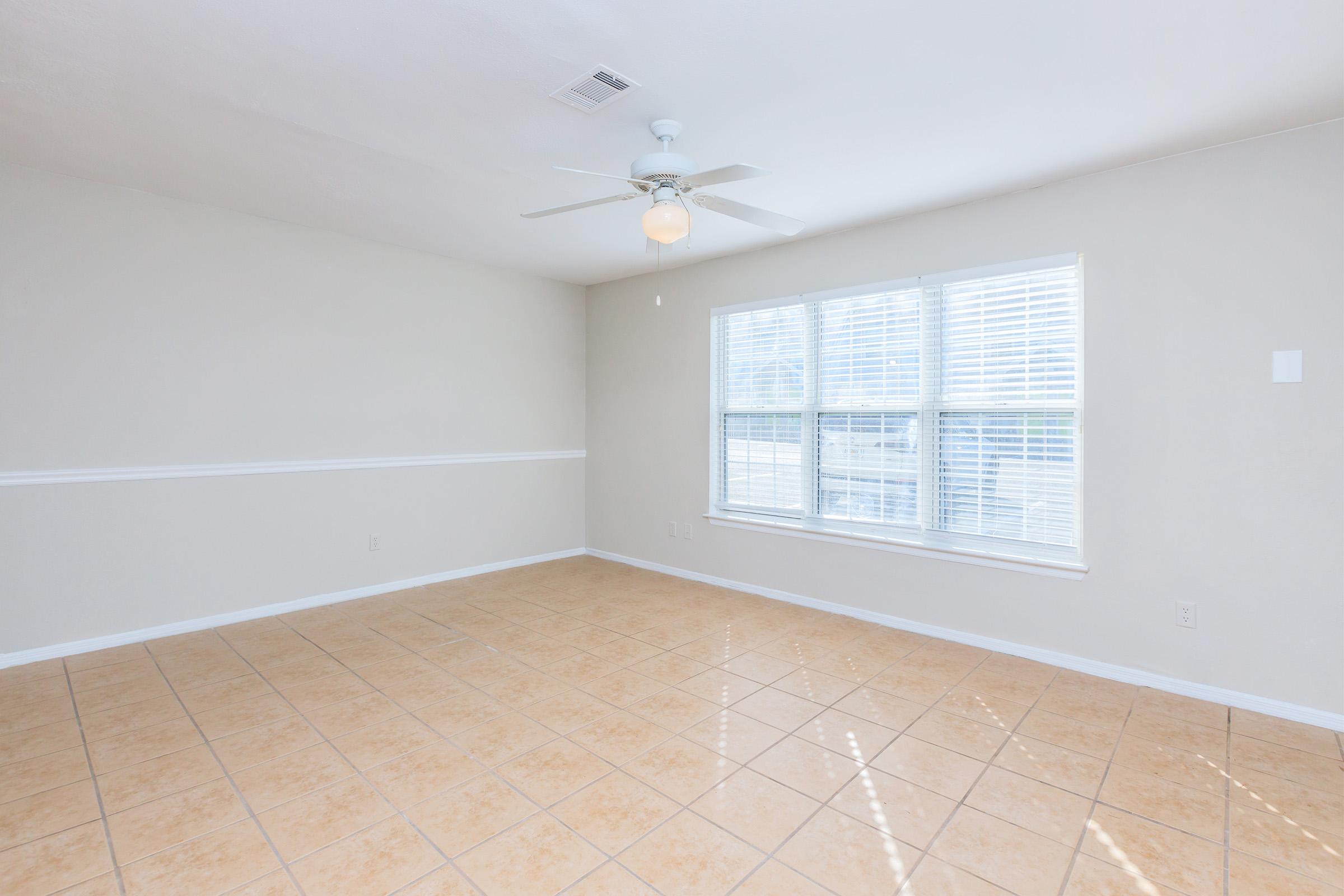 a kitchen with a tile floor