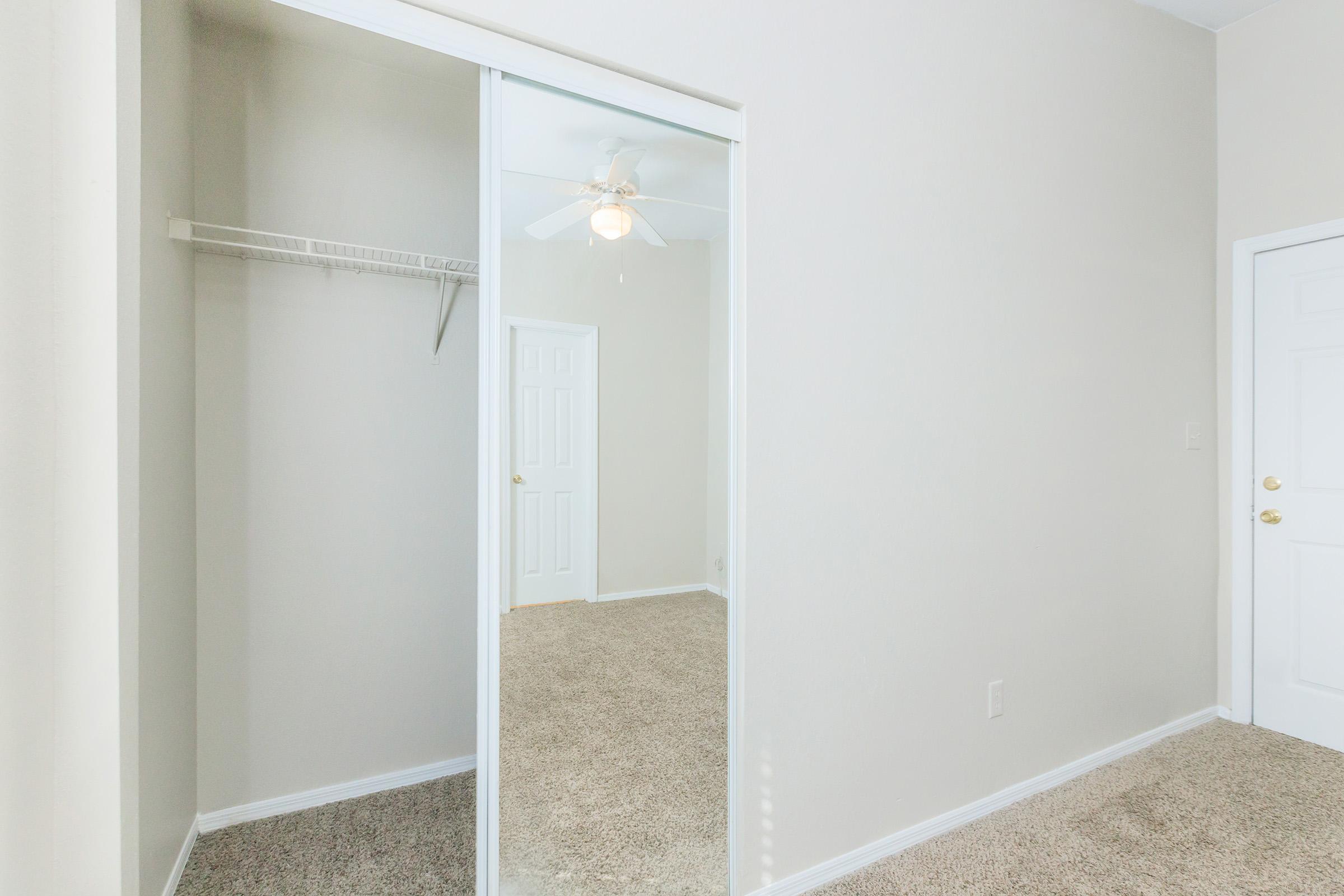 a room with a sink and a mirror