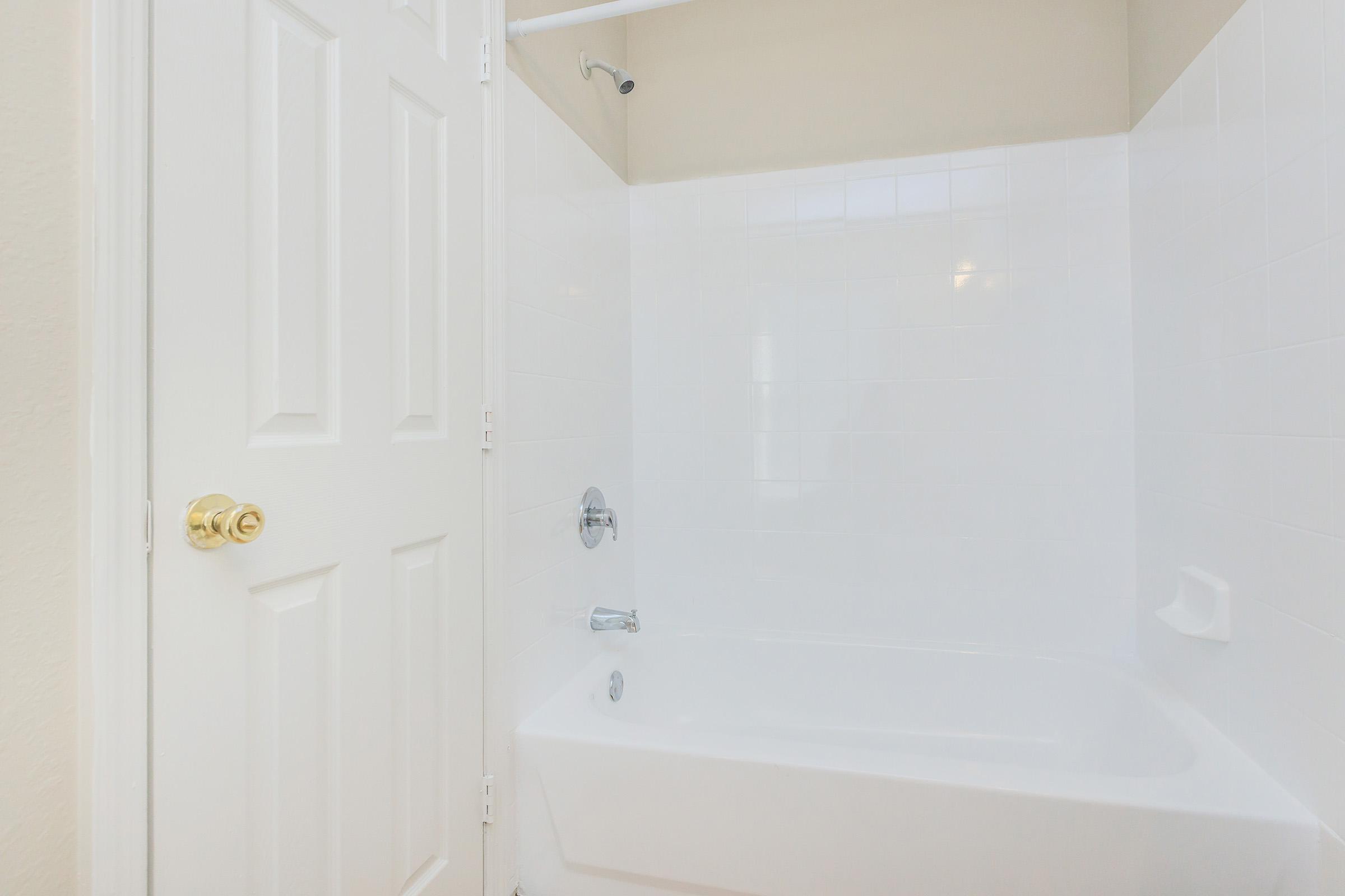 a room with a sink and a bath tub