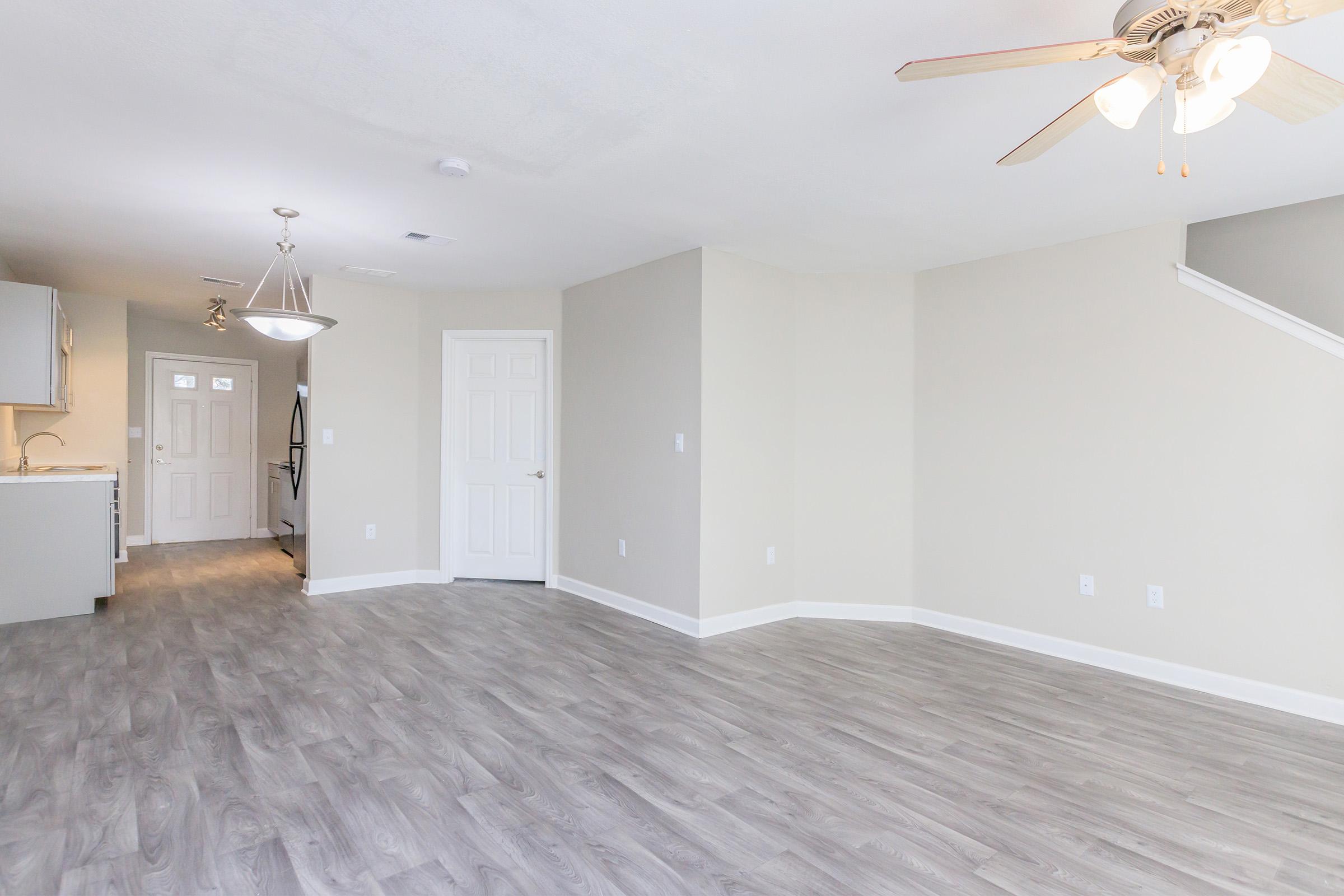 a bedroom with a wooden floor