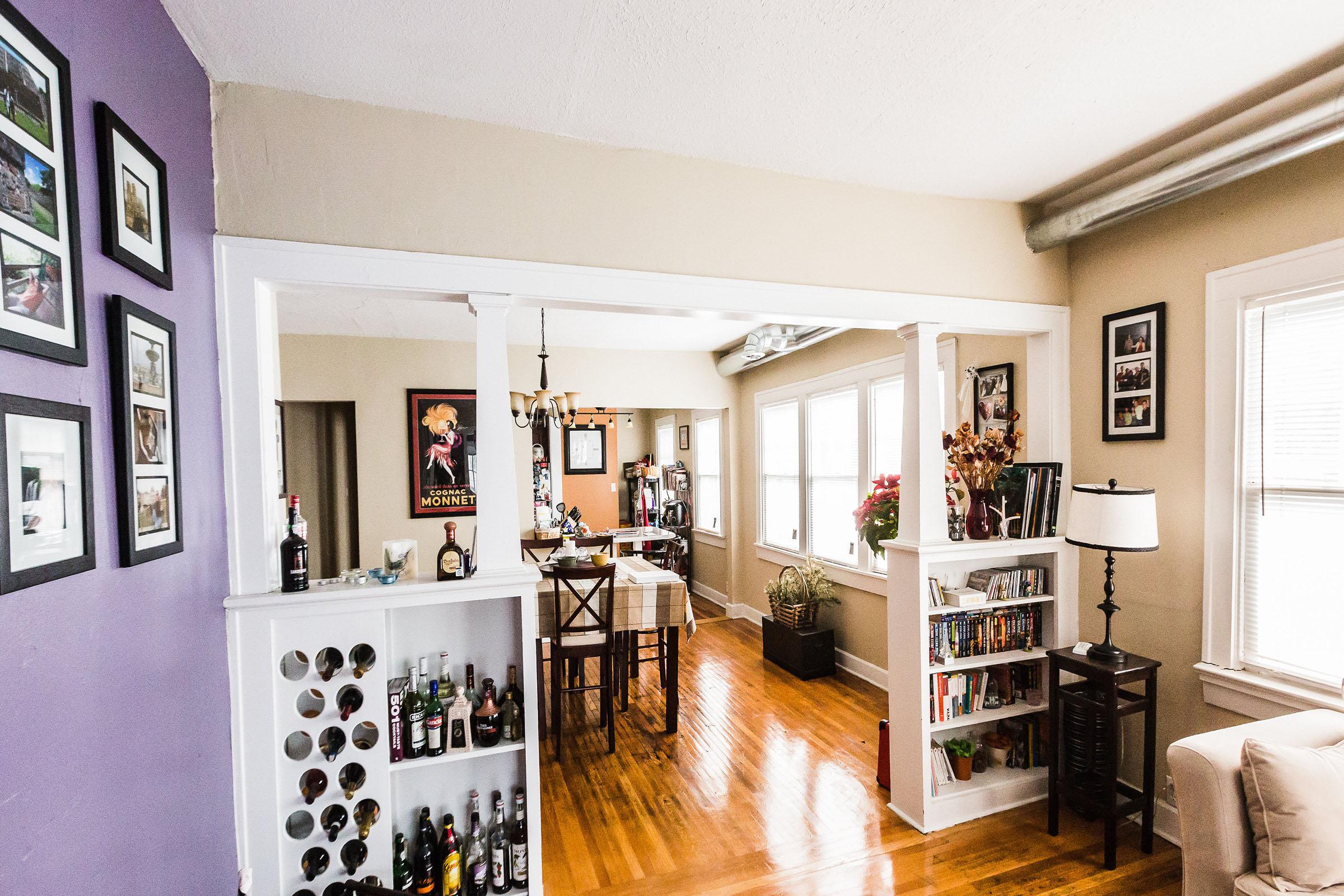a living room filled with furniture and a fireplace