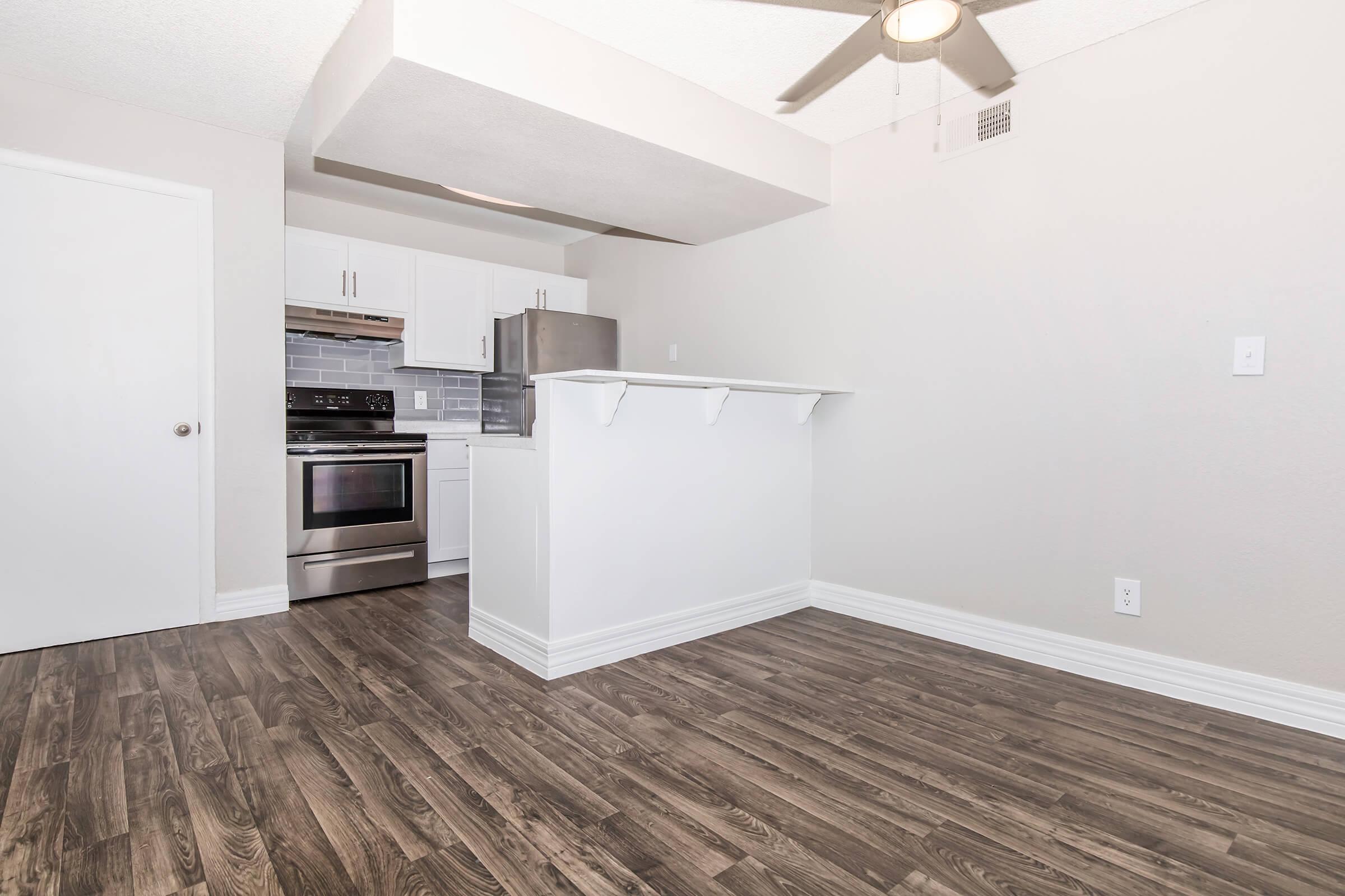 a kitchen with a building in the background