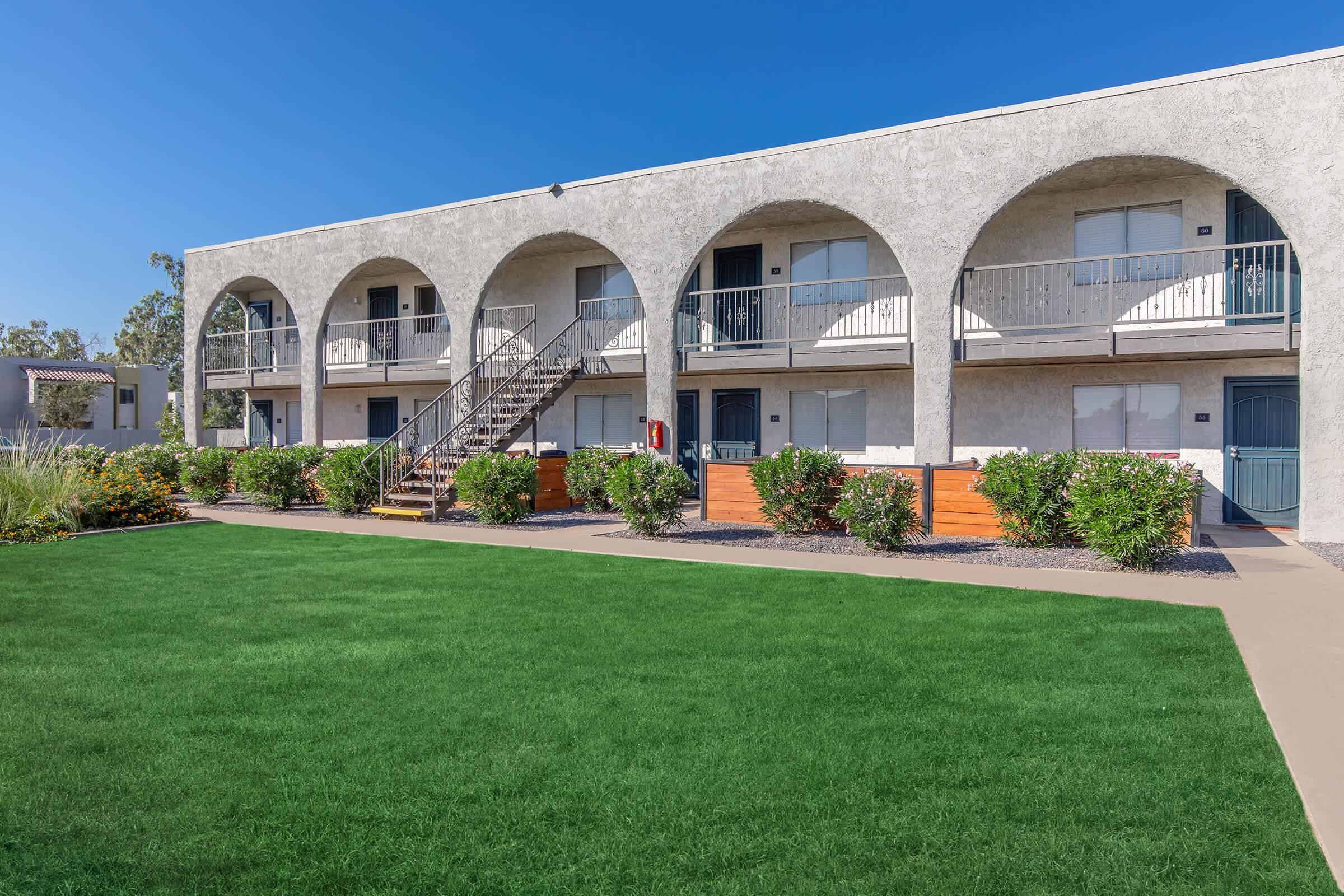 a large lawn in front of a building