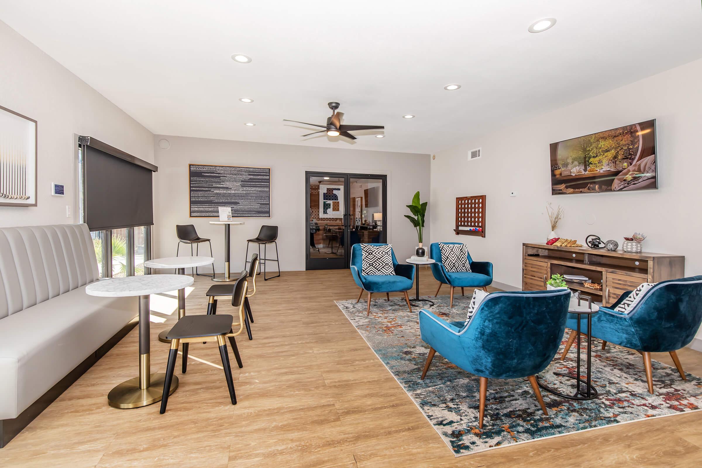 a living room filled with furniture and a table