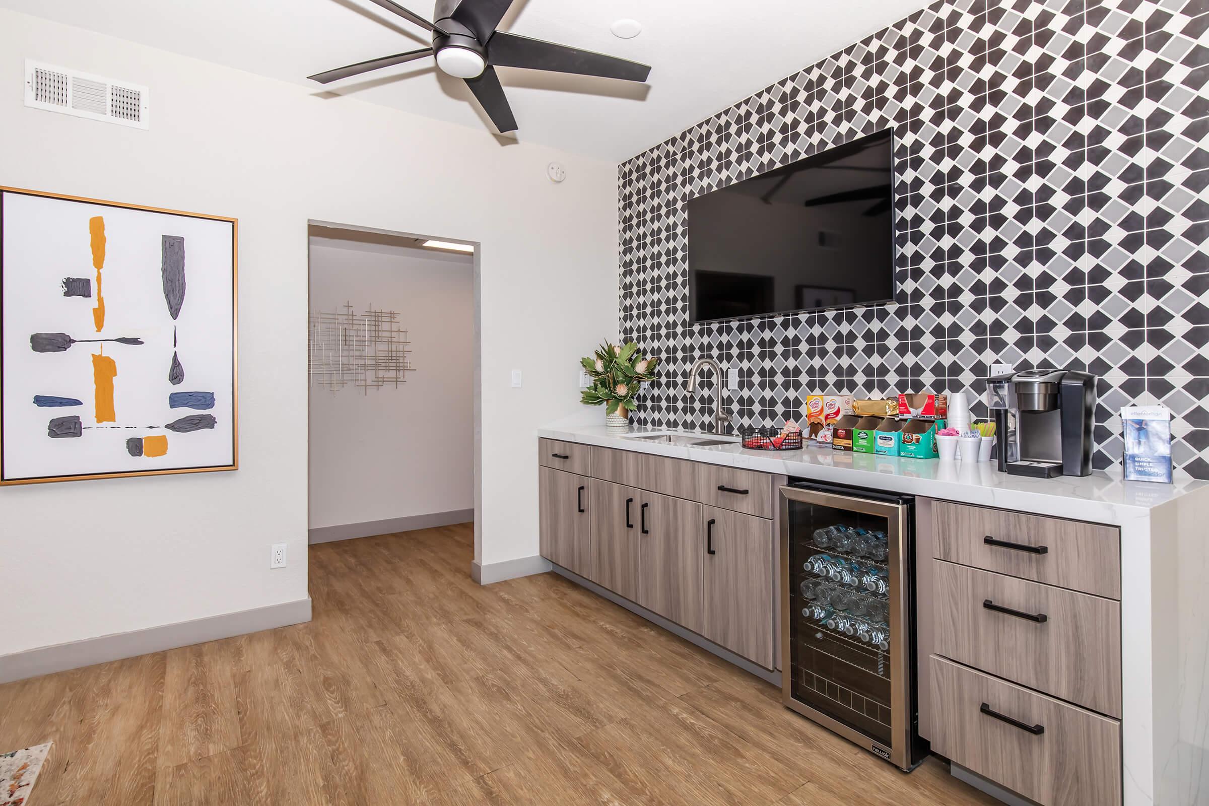 a kitchen with wooden cabinets