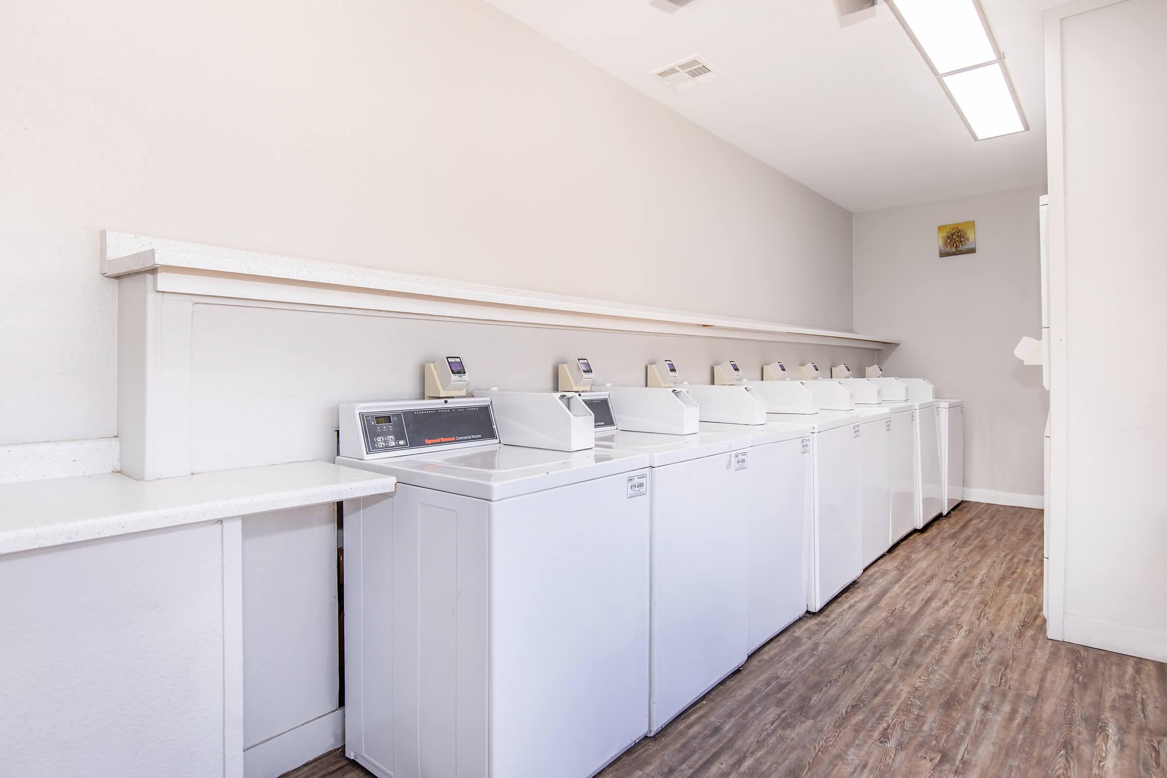 a kitchen with a sink and a refrigerator