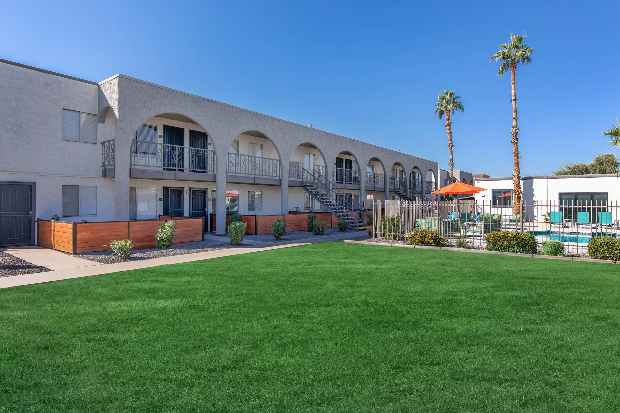 a large lawn in front of a building