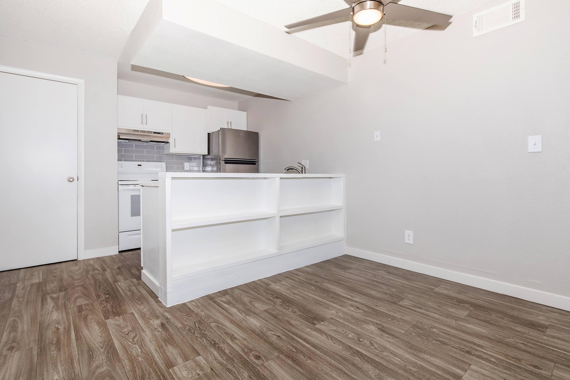 a kitchen with a wood floor