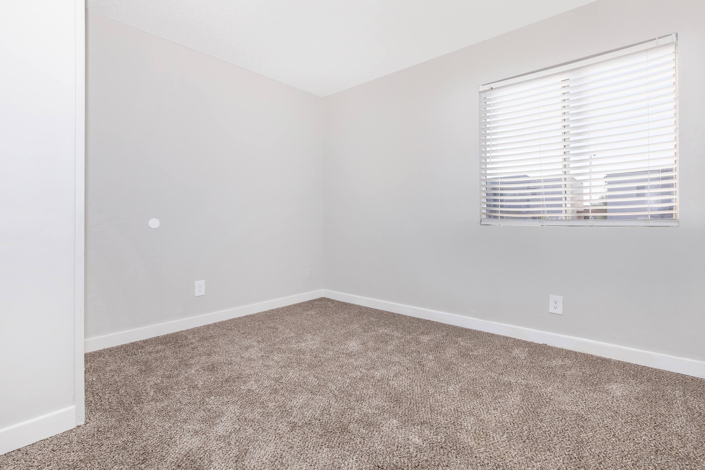 a bedroom with a large window