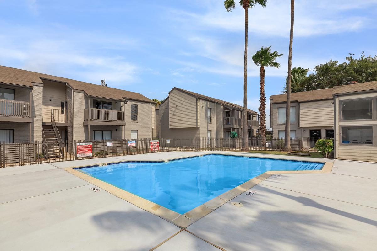 a house with a pool outside of a building