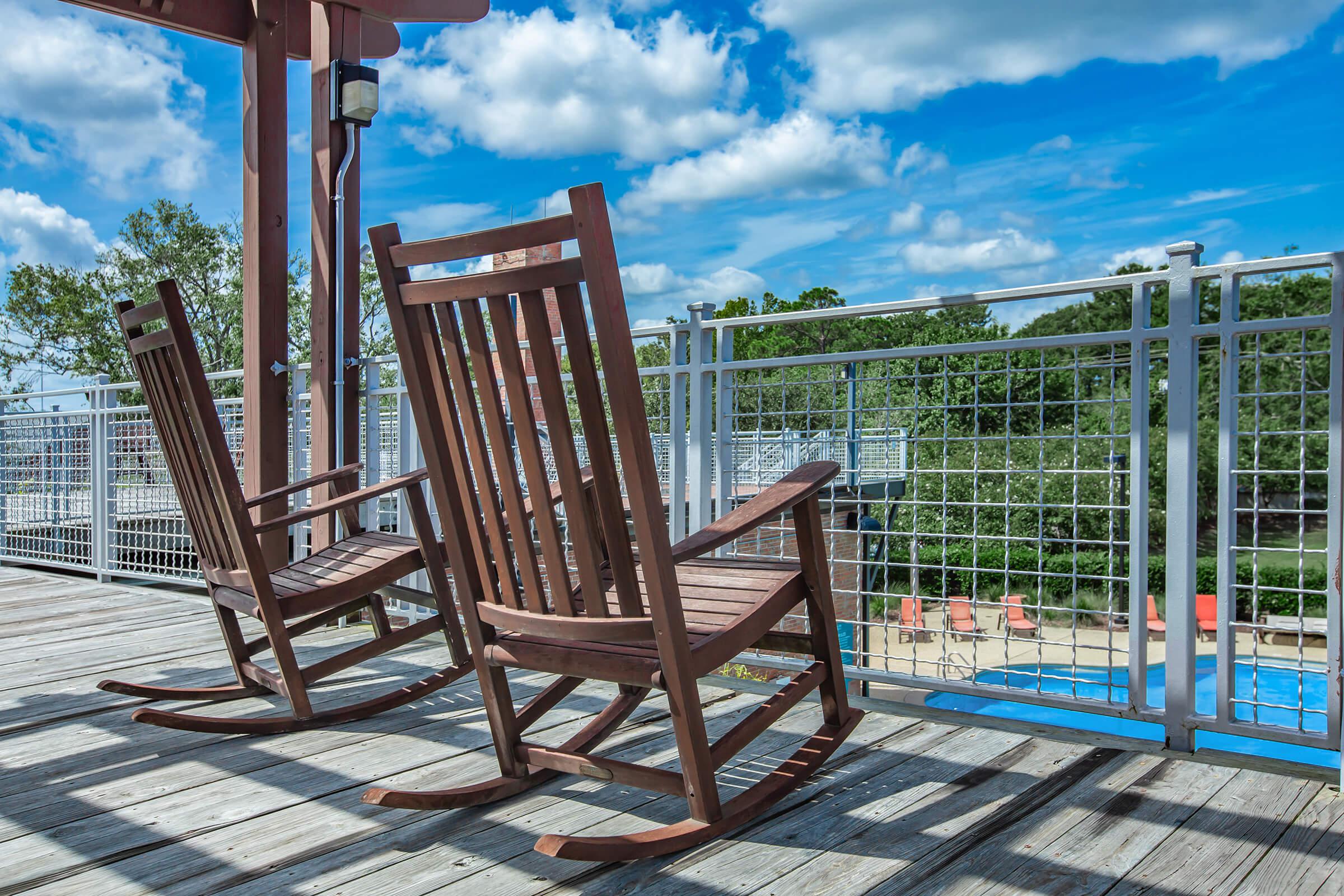 Enjoy the deck overlooking the shimmering swimming pool at South Front In Wilmington, North Carolina.