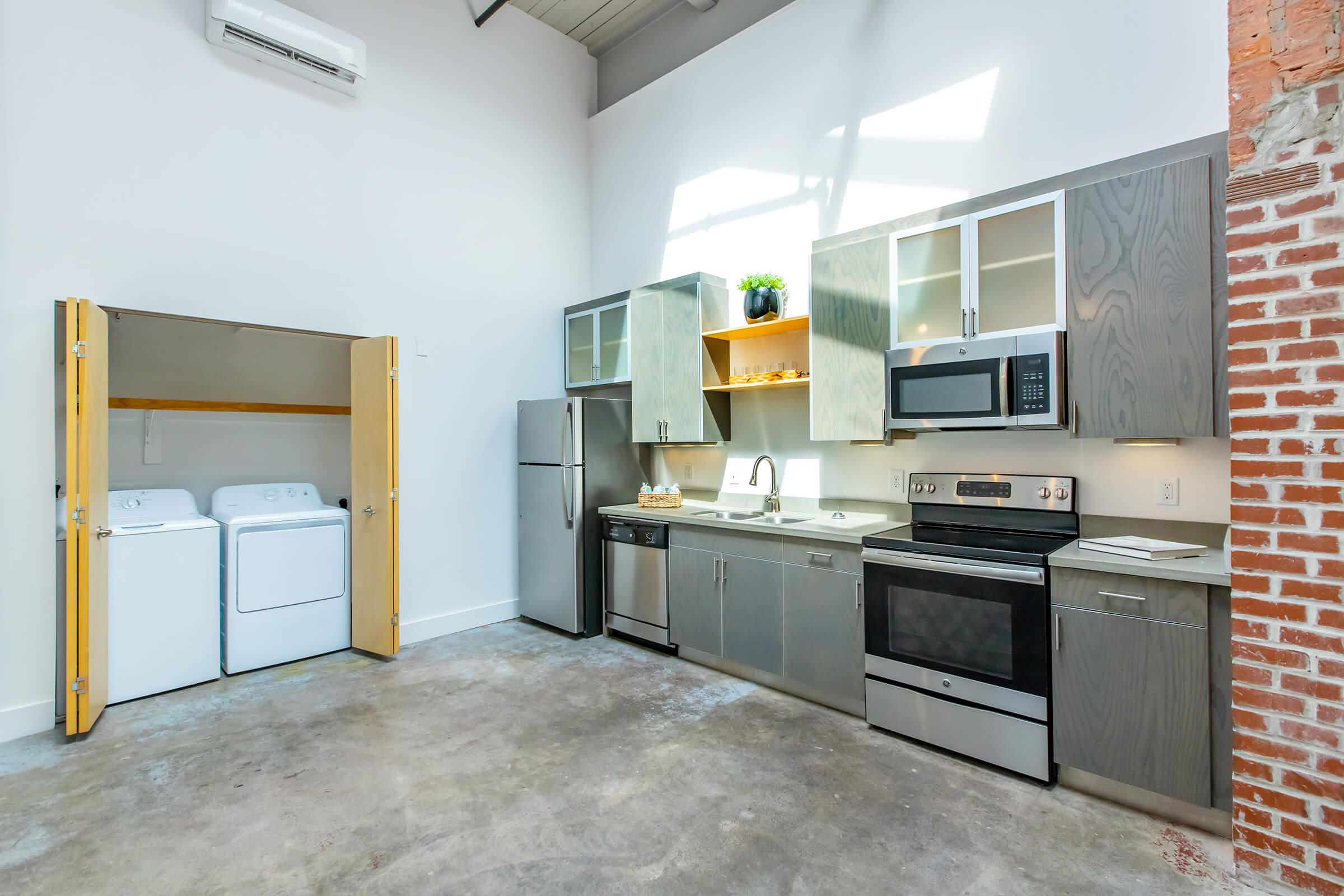 a kitchen with a stove and a refrigerator