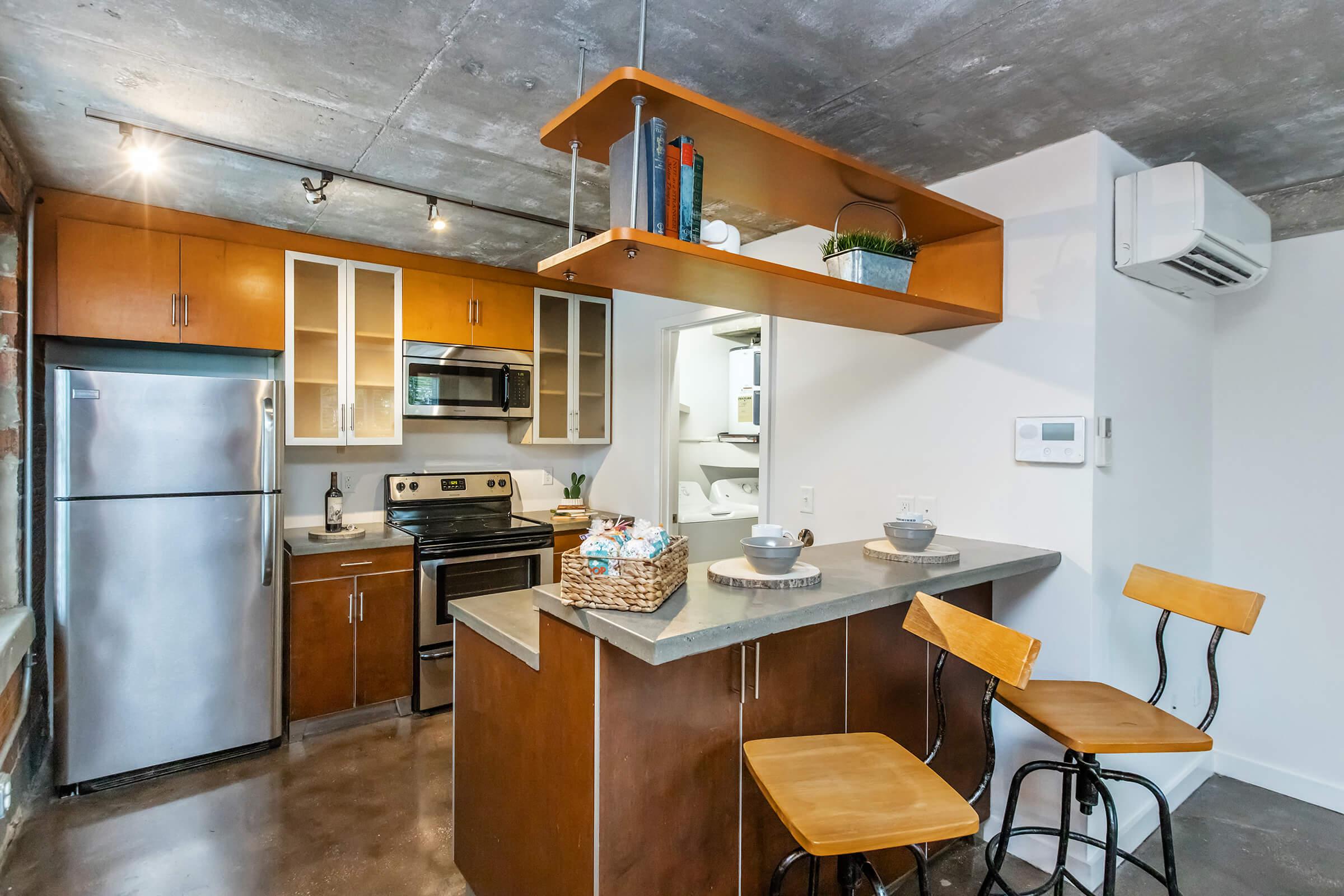 a kitchen with an island in the middle of a table