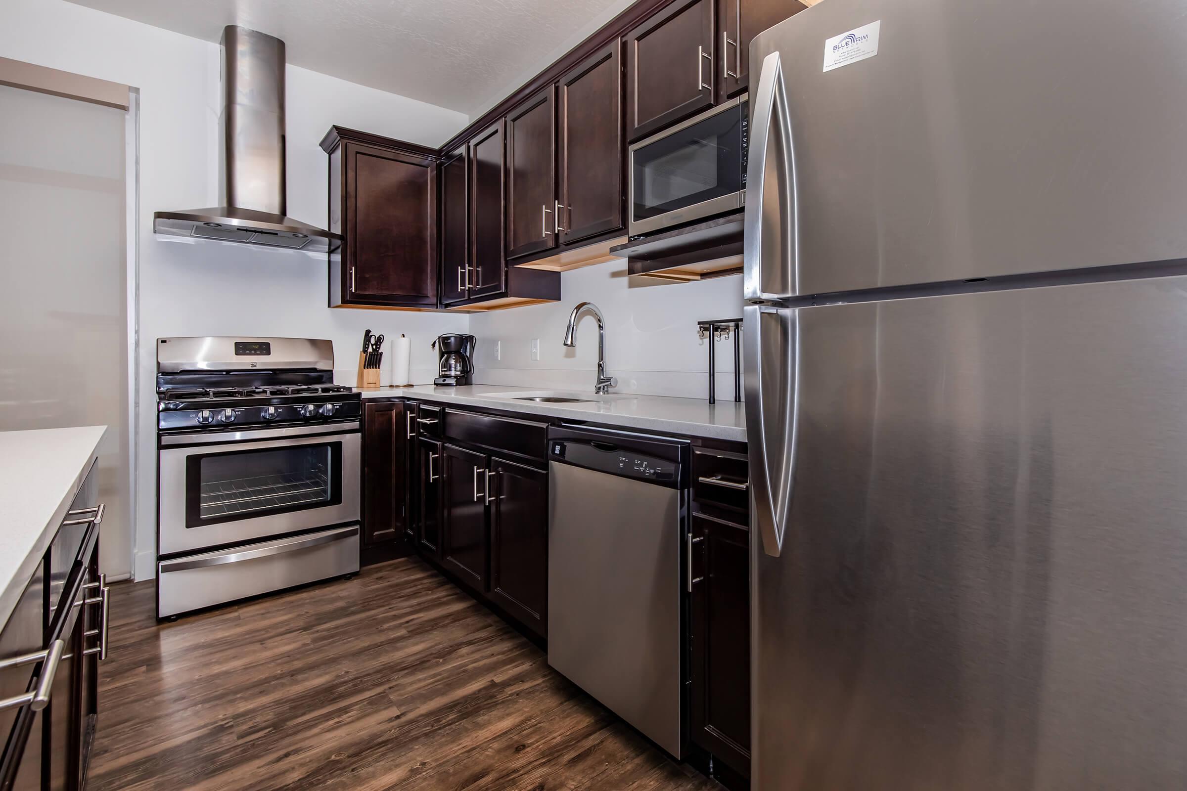 a modern kitchen with stainless steel appliances