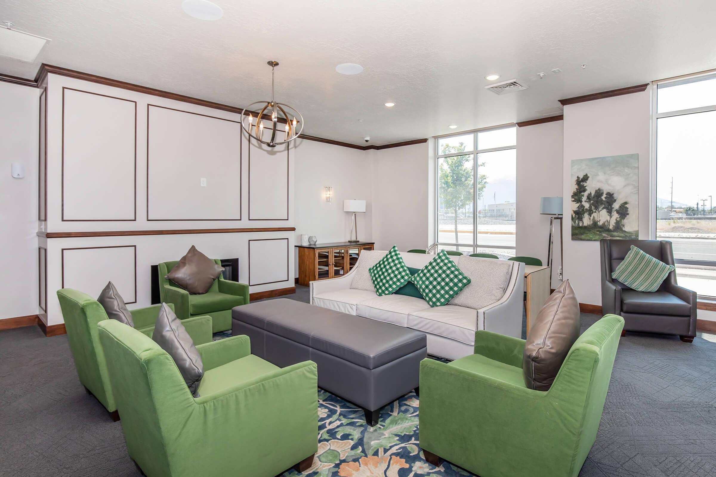 a living room filled with furniture and a large window