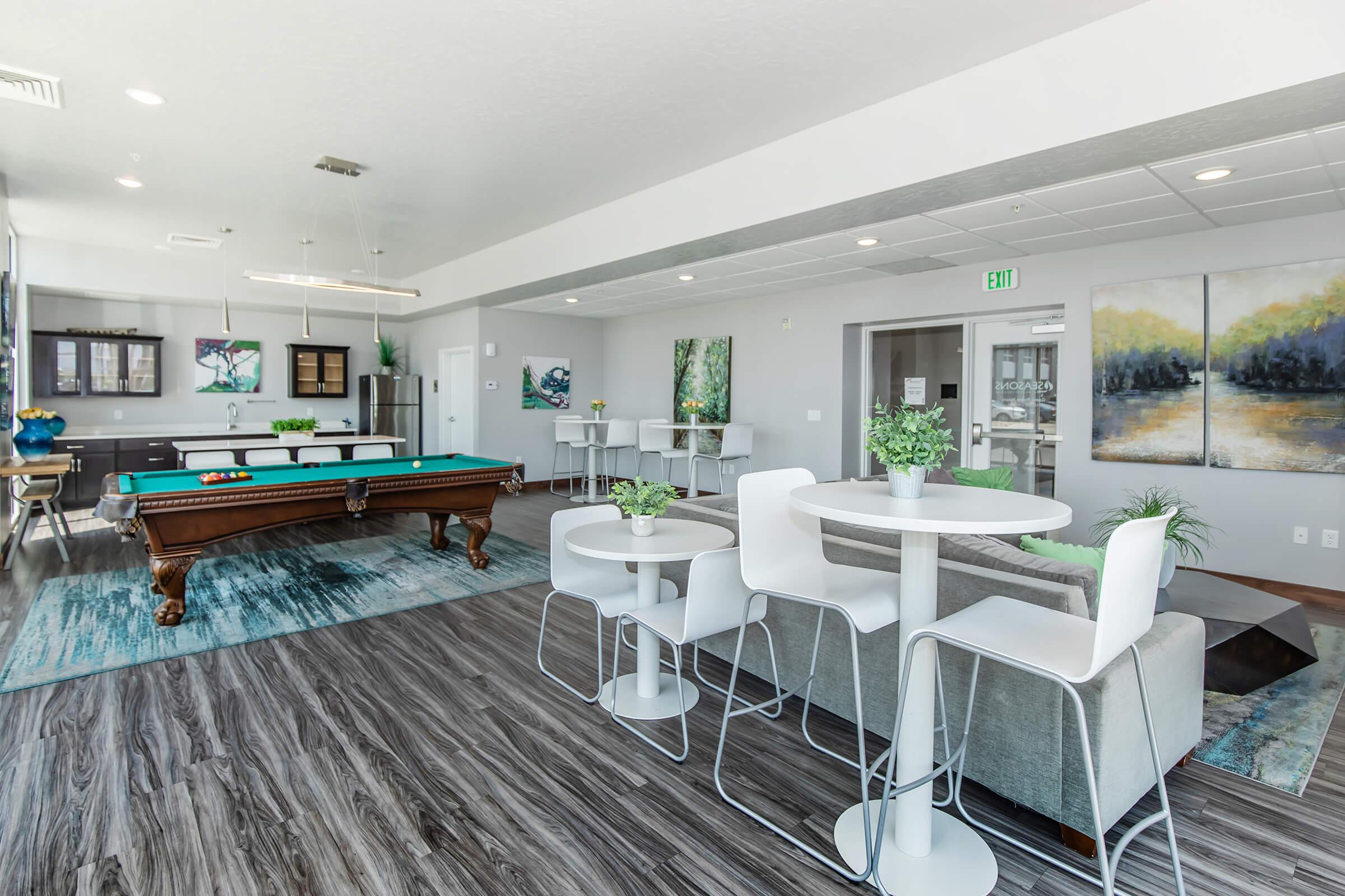 a living room filled with furniture and a table