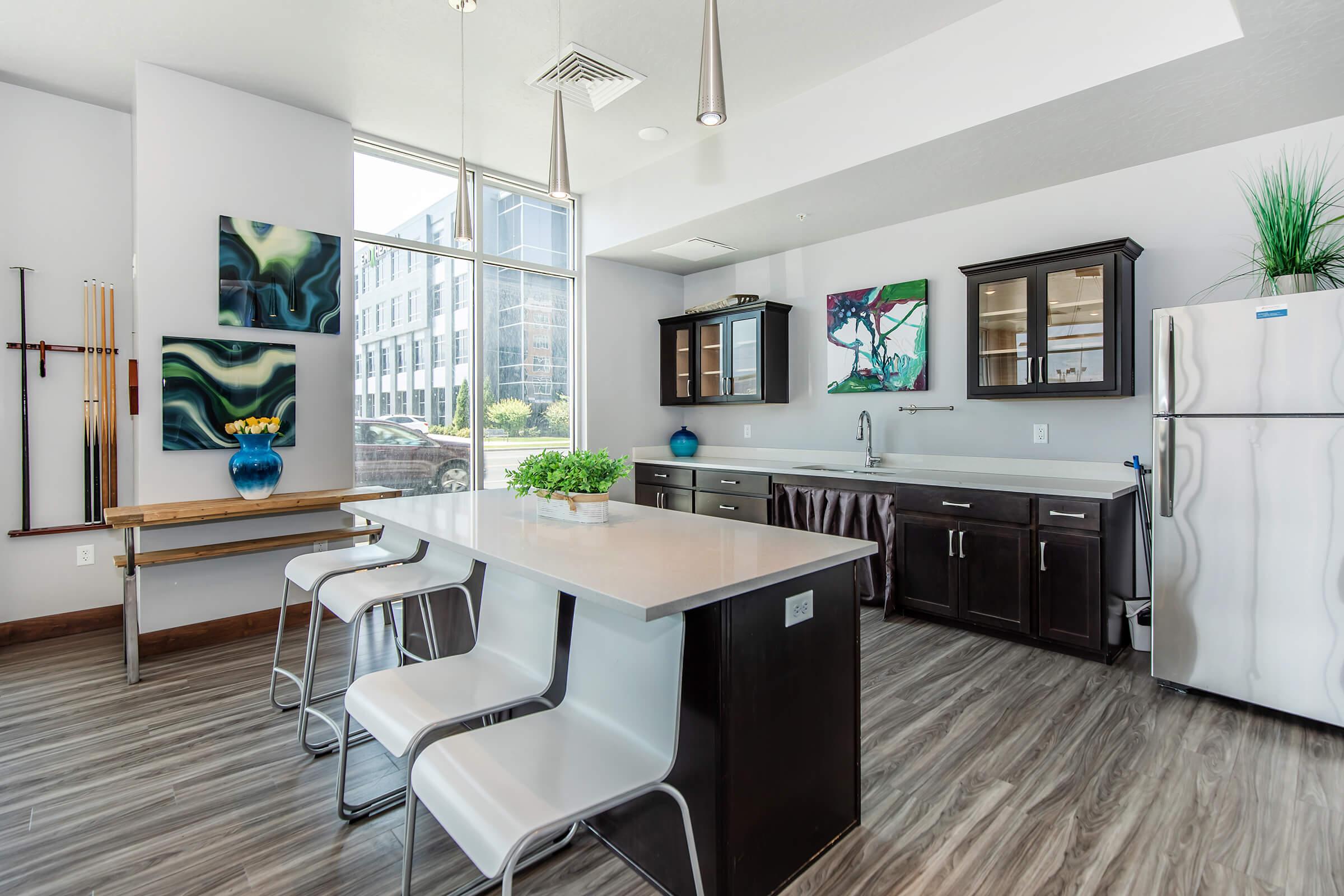 a kitchen with a table in a room