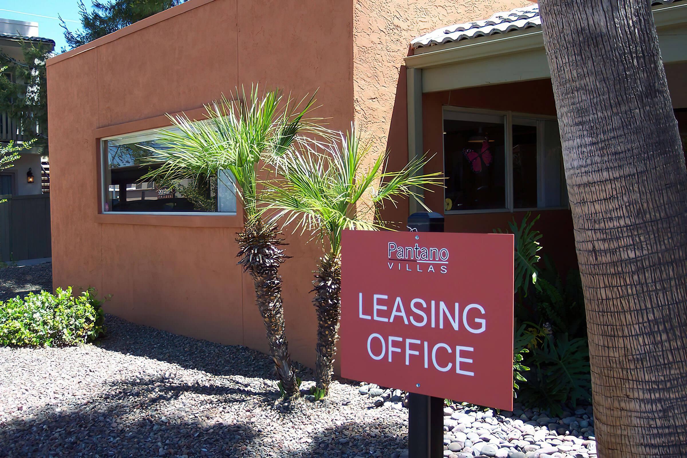 a sign in front of a house