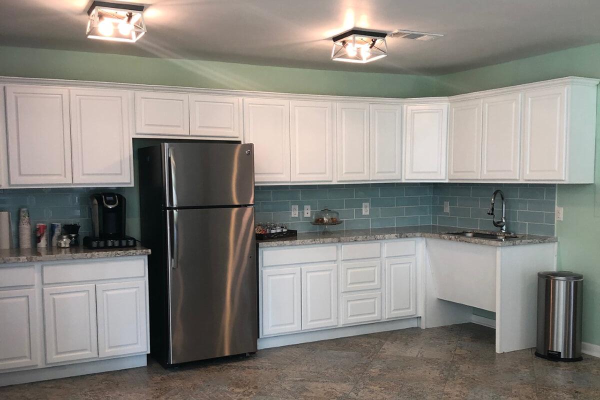 a large kitchen with stainless steel appliances