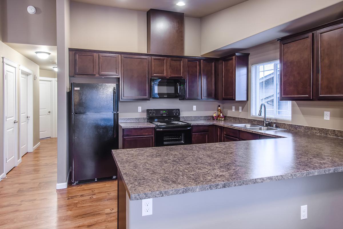 a kitchen with an island in the middle of a room