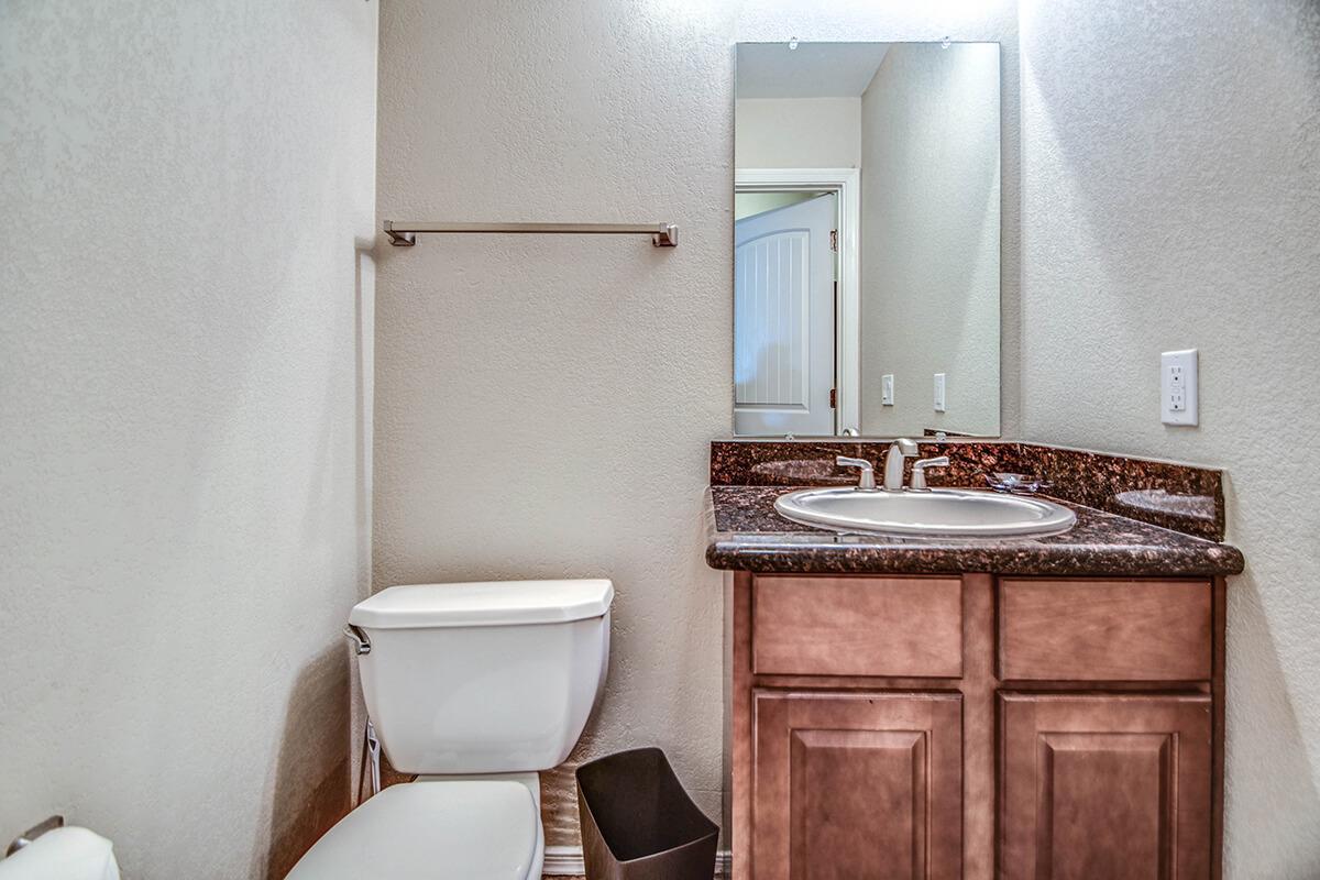 a white sink sitting next to a door