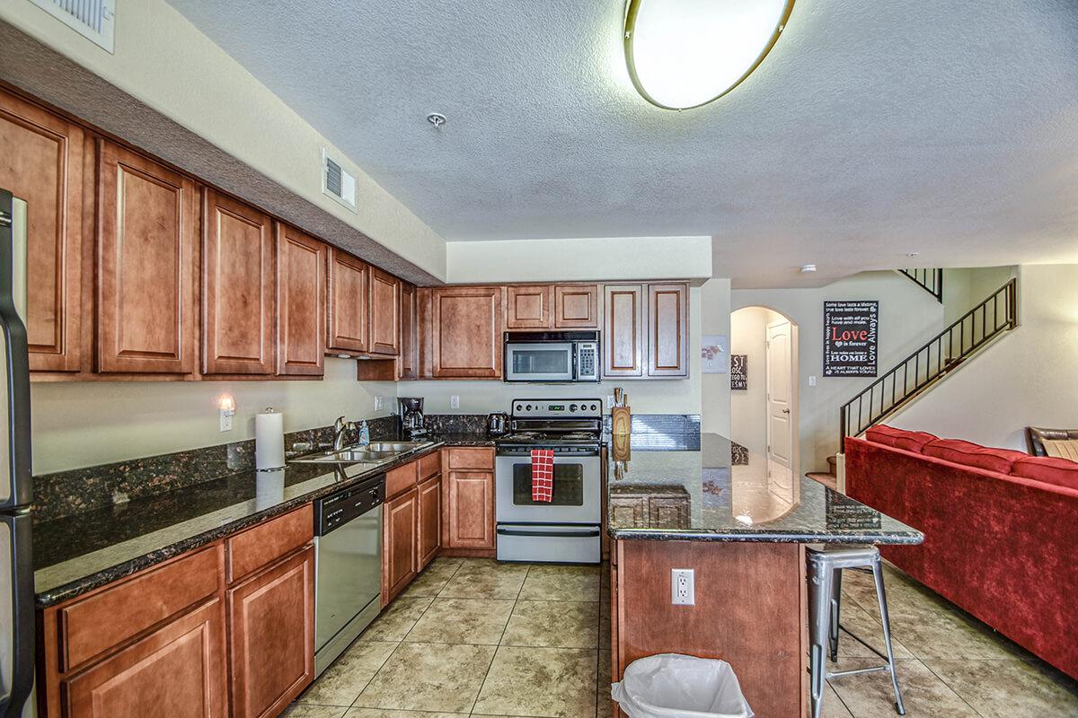 a kitchen with an island in the middle of a room