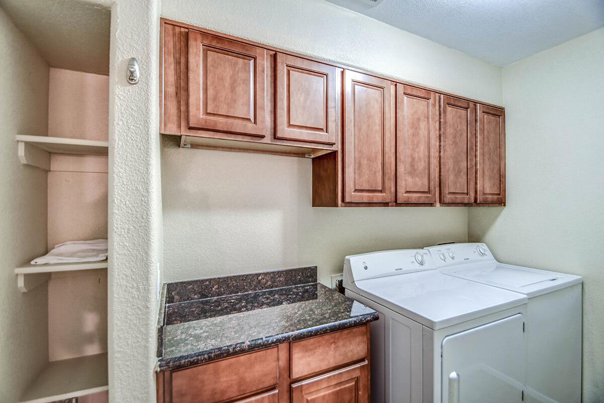 a kitchen with a sink and a refrigerator