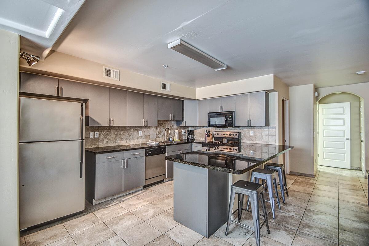 a large kitchen with stainless steel appliances