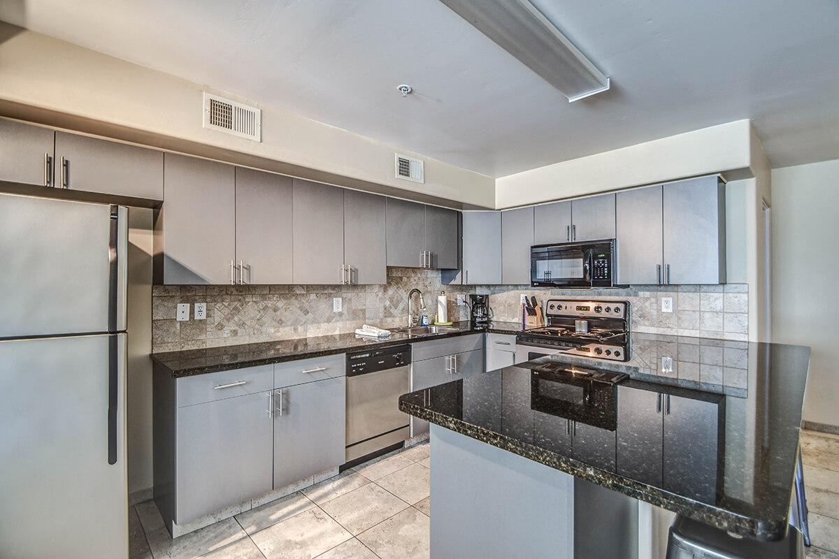 a large kitchen with stainless steel appliances