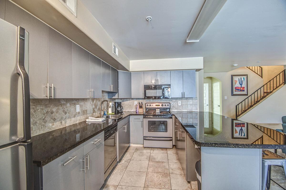 a large kitchen with stainless steel appliances