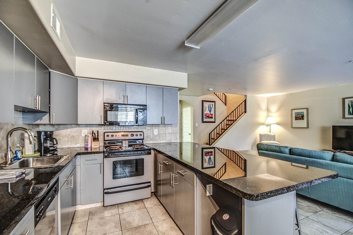 a modern kitchen with stainless steel appliances