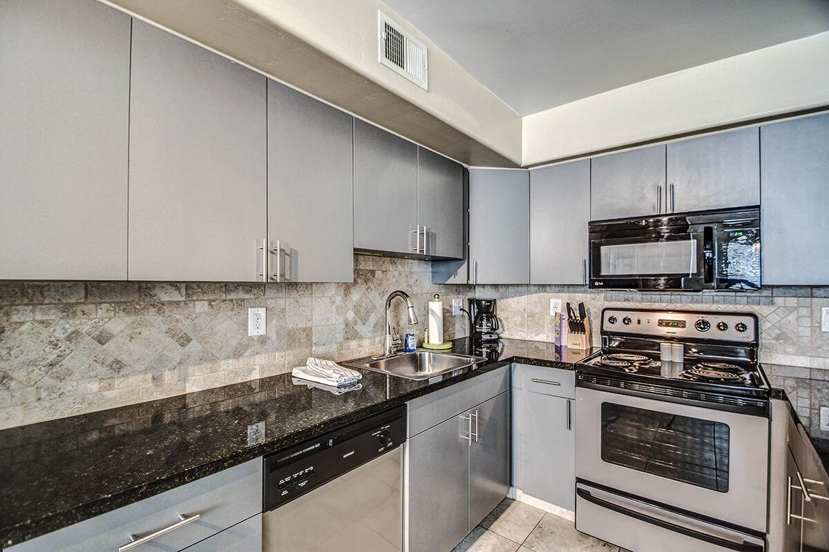 a modern kitchen with stainless steel appliances